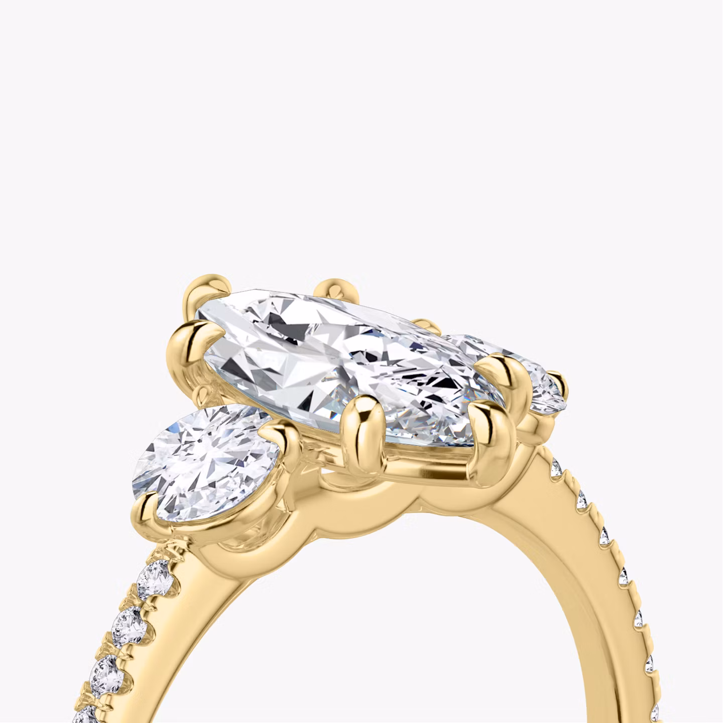 The Three Stone | Marquise | 18k | Yellow Gold | bandAccent: Pavé | sideStoneCarat: 0.25ct | sideStoneShape: Round Brilliant | diamondOrientation: vertical | caratWeight: other