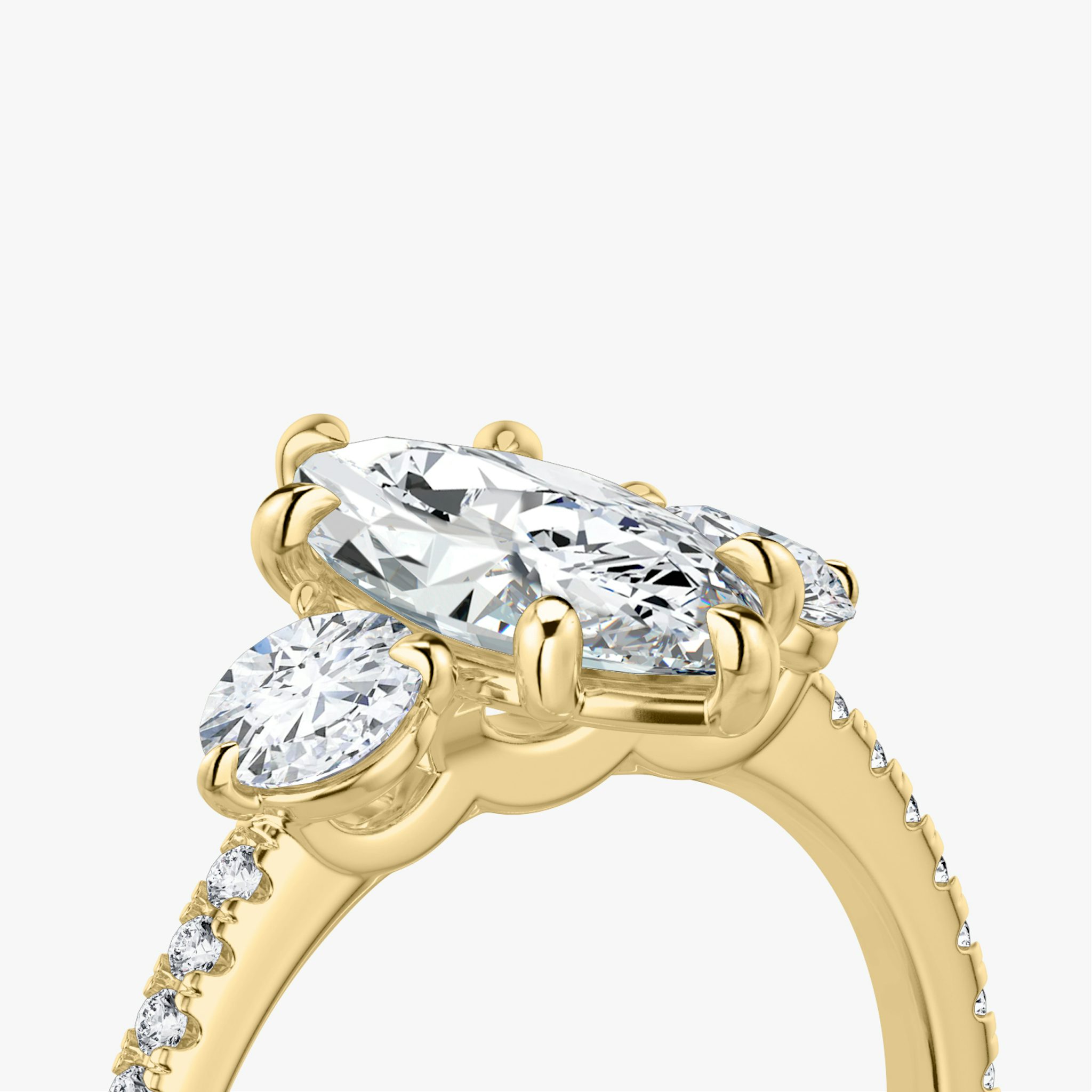 The Three Stone | Marquise | 18k | Yellow Gold | bandAccent: Pavé | sideStoneCarat: 0.25ct | sideStoneShape: Round Brilliant | diamondOrientation: vertical | caratWeight: other