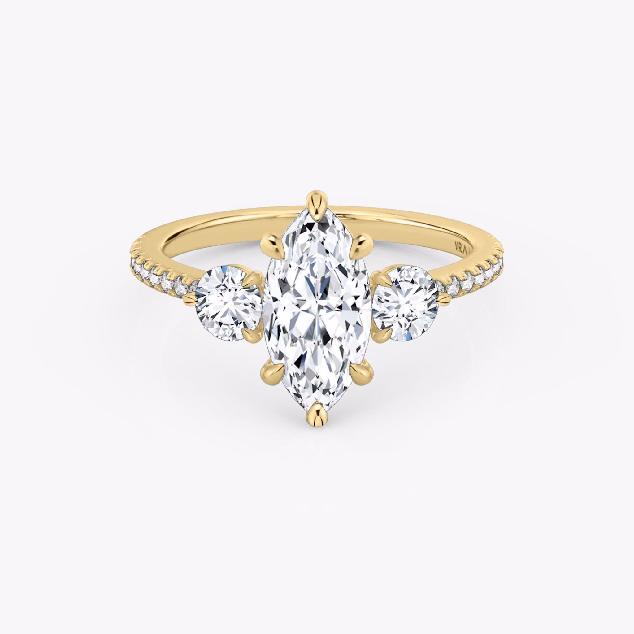 The Three Stone | Marquise | 18k | Yellow Gold | bandAccent: Pavé | sideStoneCarat: 0.25ct | sideStoneShape: Round Brilliant | diamondOrientation: vertical | caratWeight: other
