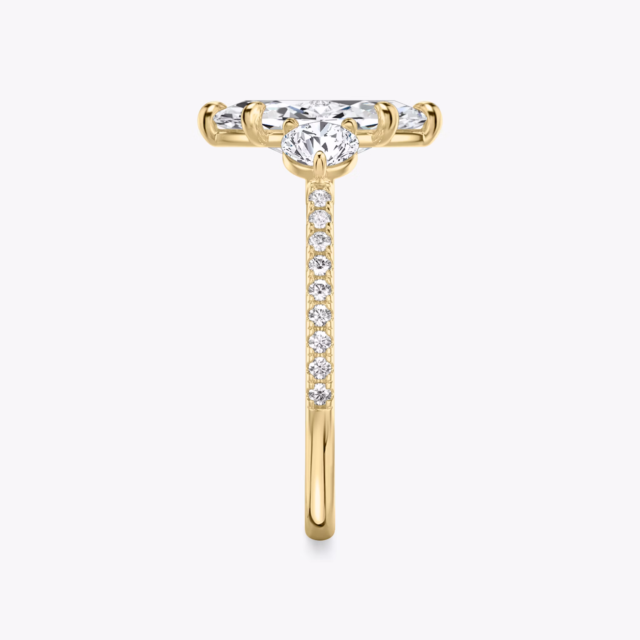 The Three Stone | Marquise | 18k | Yellow Gold | bandAccent: Pavé | sideStoneCarat: 0.25ct | sideStoneShape: Round Brilliant | diamondOrientation: vertical | caratWeight: other