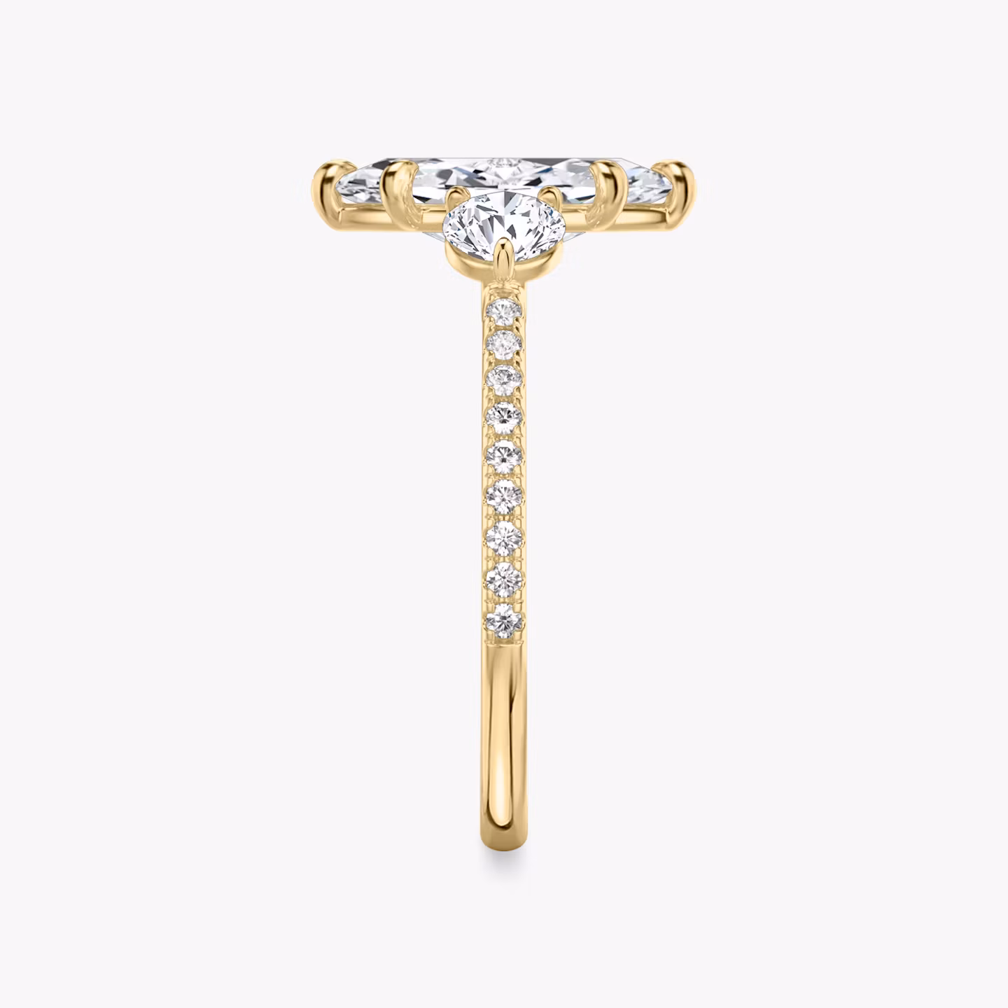 The Three Stone | Marquise | 18k | Yellow Gold | bandAccent: Pavé | sideStoneCarat: 0.25ct | sideStoneShape: Round Brilliant | diamondOrientation: vertical | caratWeight: other
