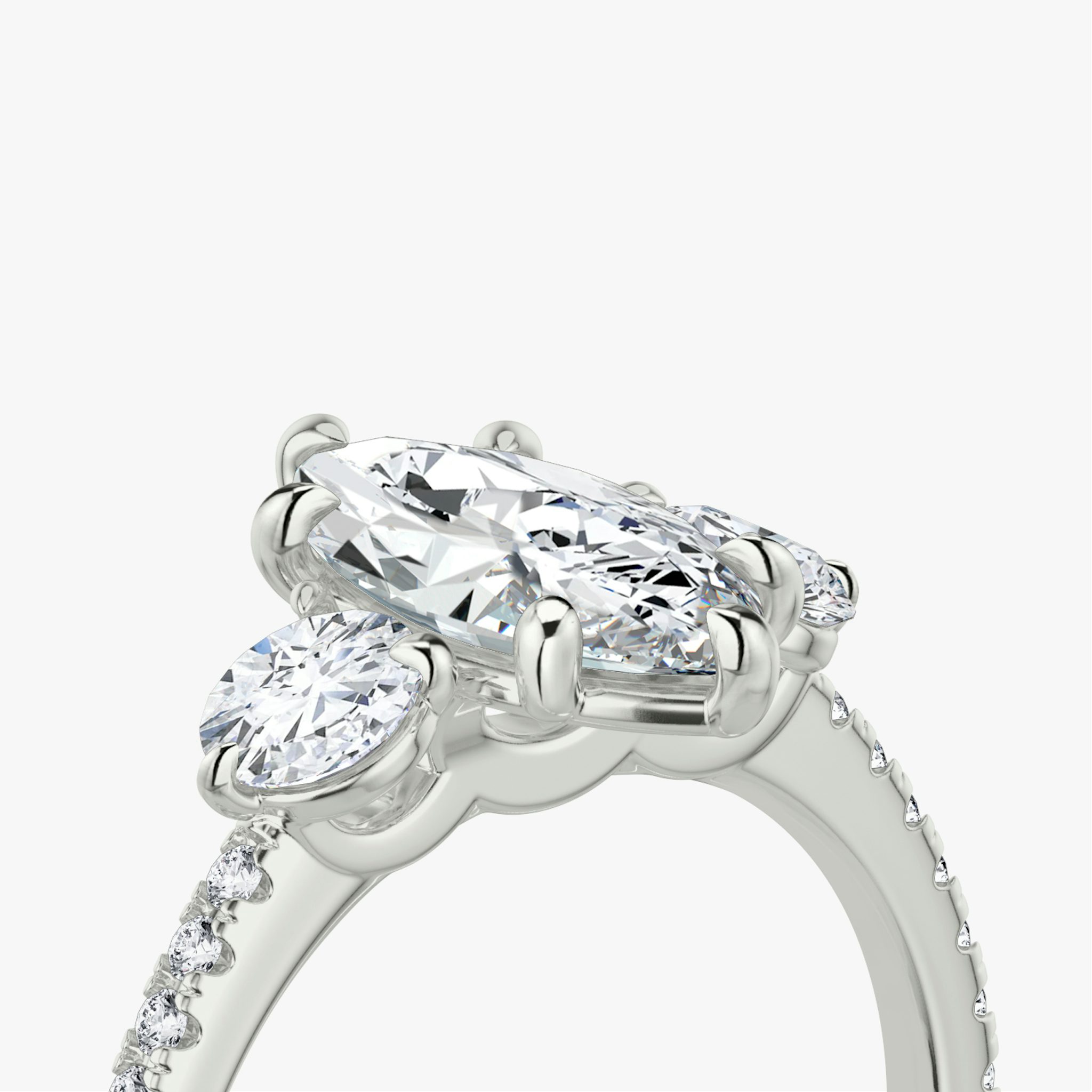 The Three Stone | Marquise | 18k | White Gold | bandAccent: Pavé | sideStoneCarat: 0.25ct | sideStoneShape: Round Brilliant | diamondOrientation: vertical | caratWeight: other