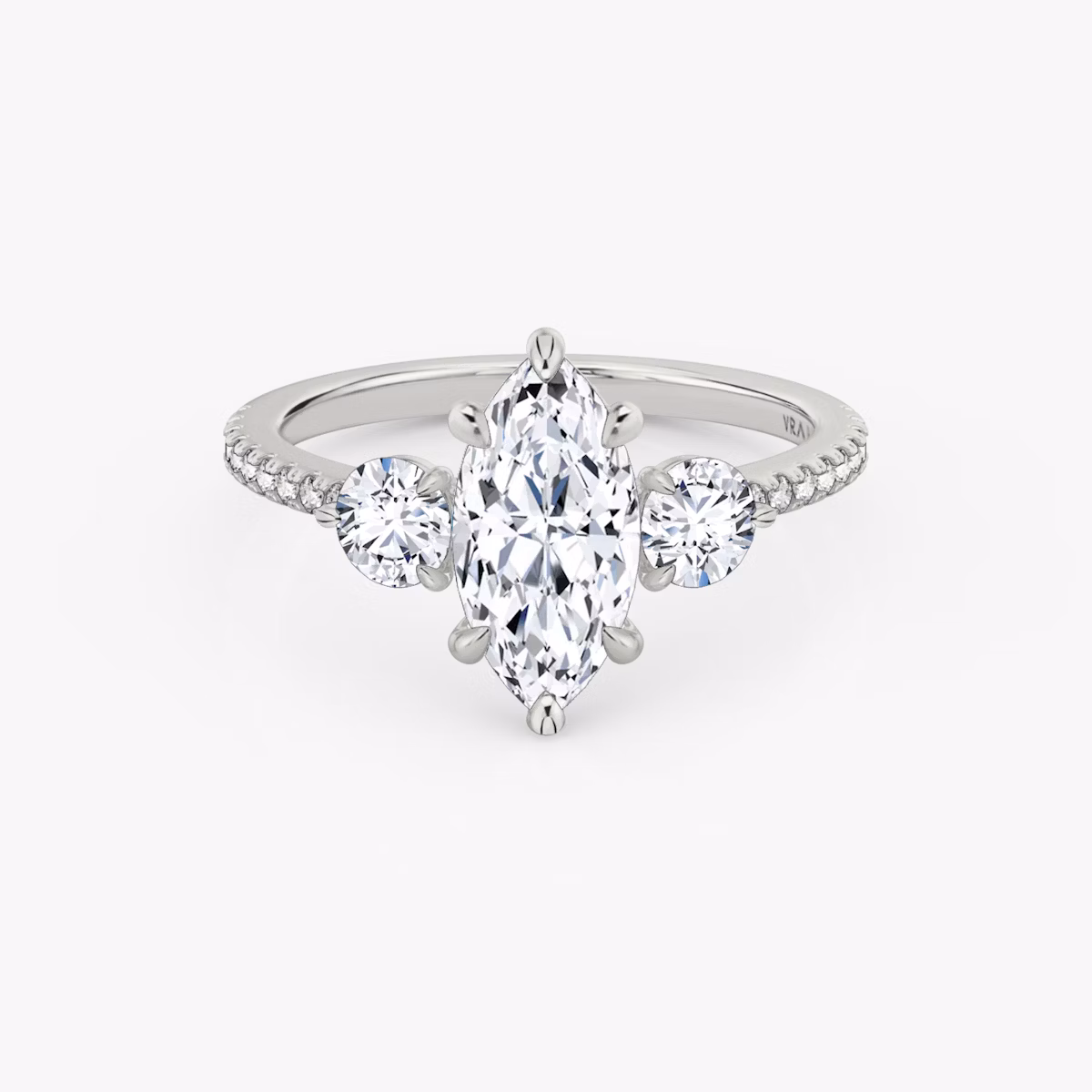 The Three Stone | Marquise | Platinum | bandAccent: Pavé | sideStoneCarat: 0.25ct | sideStoneShape: Round Brilliant | diamondOrientation: vertical | caratWeight: other