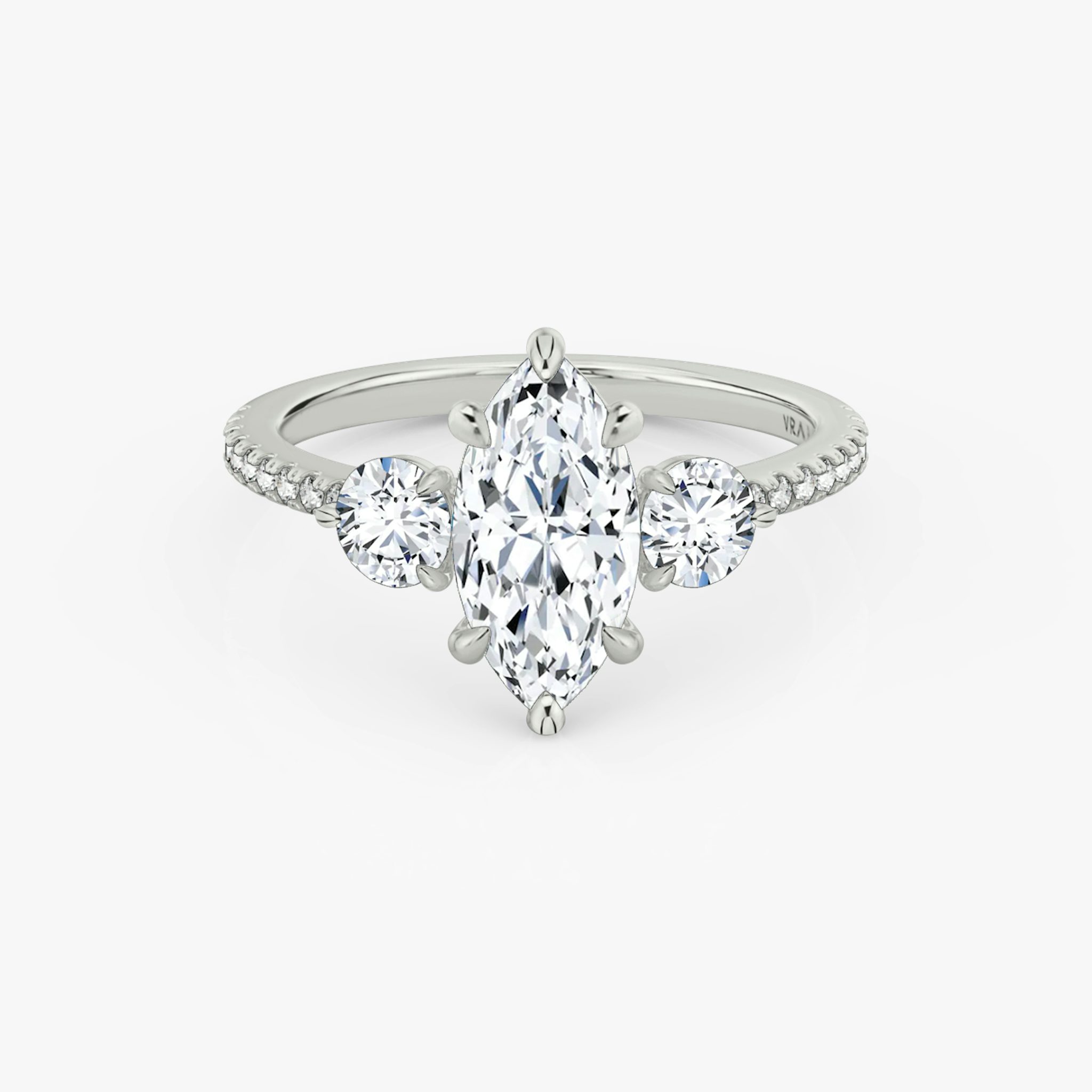 The Three Stone | Marquise | 18k | White Gold | bandAccent: Pavé | sideStoneCarat: 0.25ct | sideStoneShape: Round Brilliant | diamondOrientation: vertical | caratWeight: other
