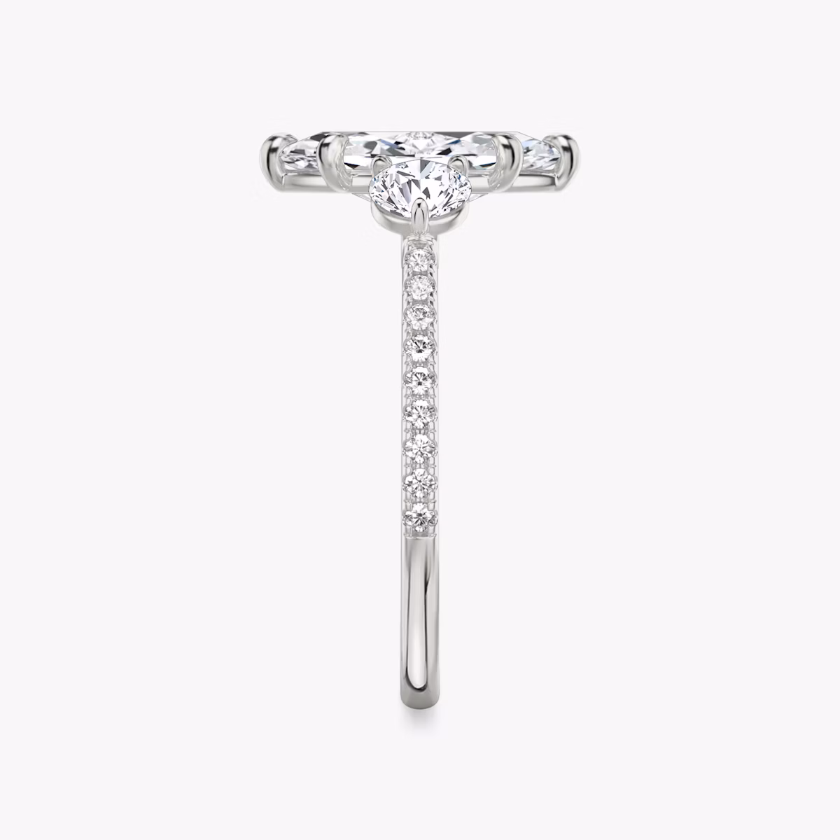 The Three Stone | Marquise | Platinum | bandAccent: Pavé | sideStoneCarat: 0.25ct | sideStoneShape: Round Brilliant | diamondOrientation: vertical | caratWeight: other