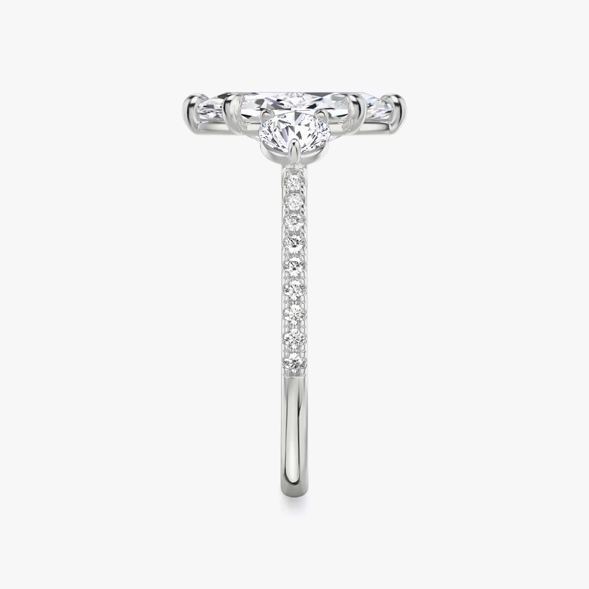 The Three Stone | Marquise | 18k | White Gold | bandAccent: Pavé | sideStoneCarat: 0.25ct | sideStoneShape: Round Brilliant | diamondOrientation: vertical | caratWeight: other
