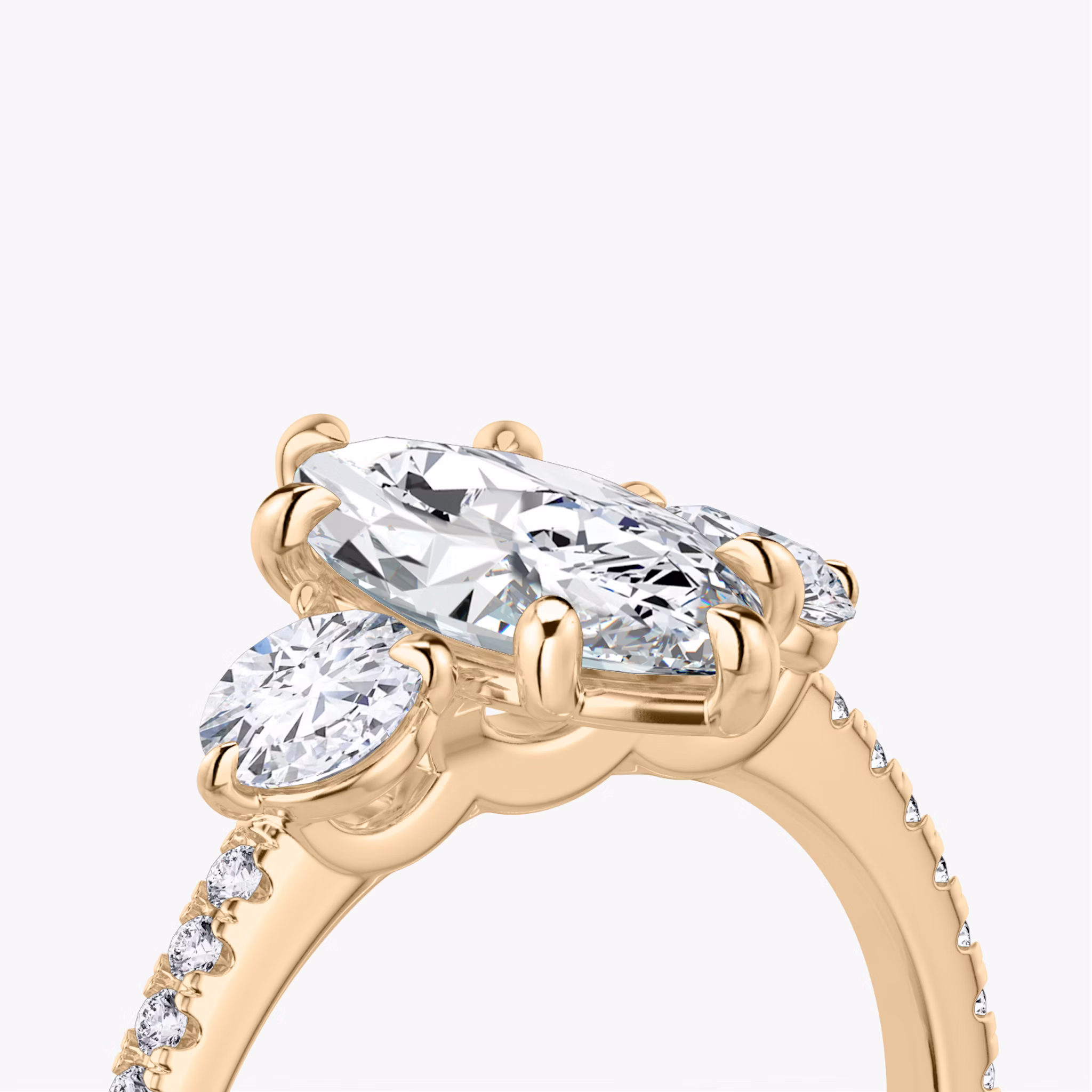 The Three Stone | Marquise | 14k | Rose Gold | bandAccent: Pavé | sideStoneCarat: 0.25ct | sideStoneShape: Round Brilliant | diamondOrientation: vertical | caratWeight: other