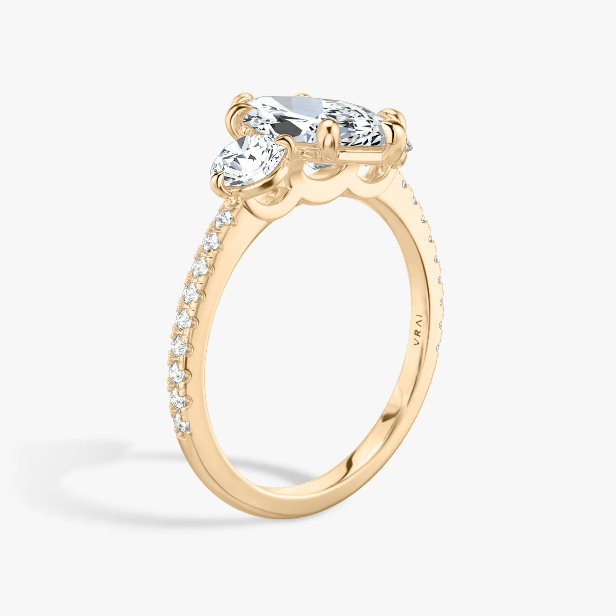 The Three Stone | Marquise | 14k | Rose Gold | bandAccent: Pavé | sideStoneCarat: 0.25ct | sideStoneShape: Round Brilliant | diamondOrientation: vertical | caratWeight: other