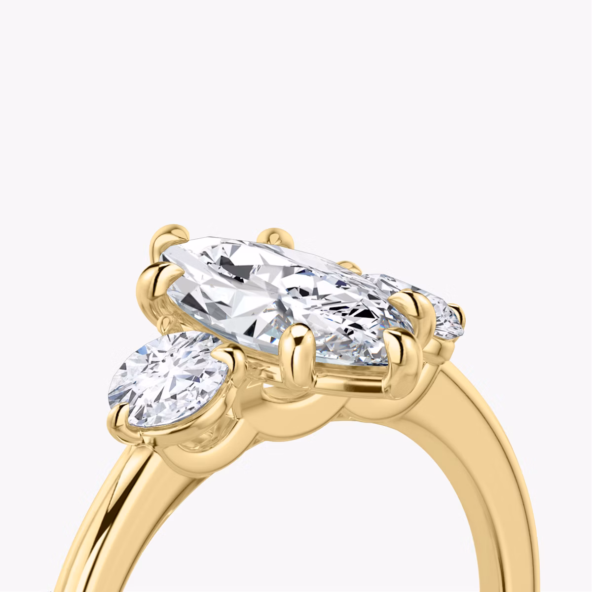 The Three Stone | Marquise | 18k | Yellow Gold | bandAccent: Plain | sideStoneCarat: 0.25ct | sideStoneShape: Round Brilliant | diamondOrientation: vertical | caratWeight: other