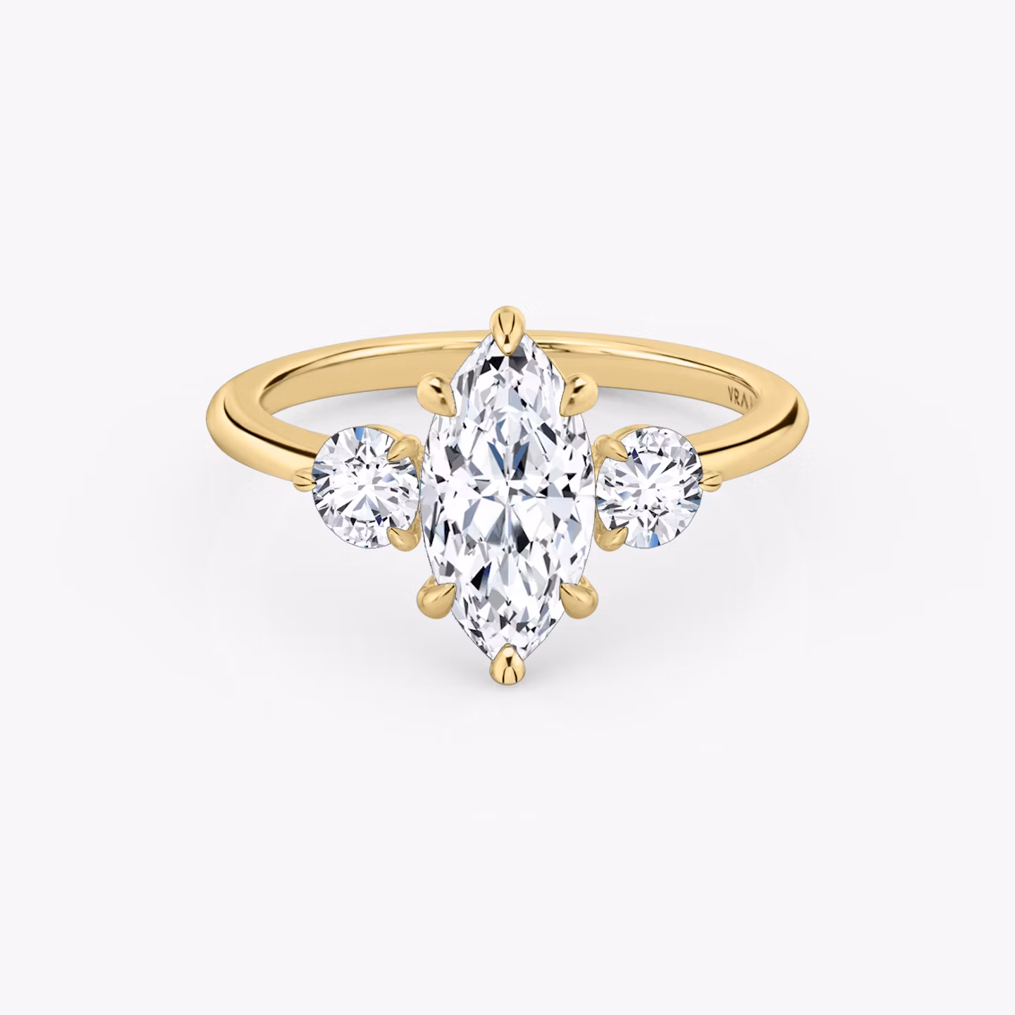 The Three Stone | Marquise | 18k | Yellow Gold | bandAccent: Plain | sideStoneCarat: 0.25ct | sideStoneShape: Round Brilliant | diamondOrientation: vertical | caratWeight: other