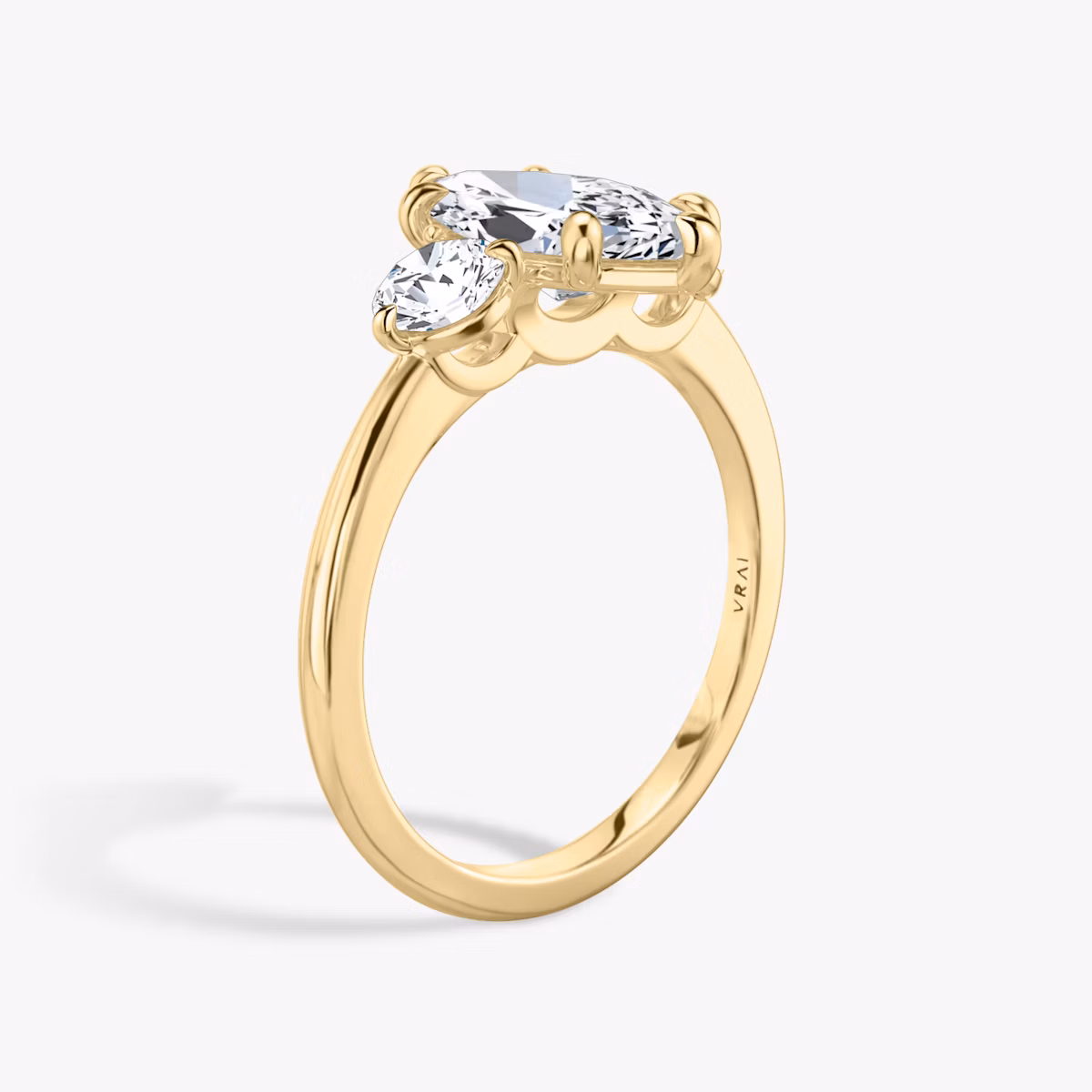 The Three Stone | Marquise | 18k | Yellow Gold | bandAccent: Plain | sideStoneCarat: 0.25ct | sideStoneShape: Round Brilliant | diamondOrientation: vertical | caratWeight: other