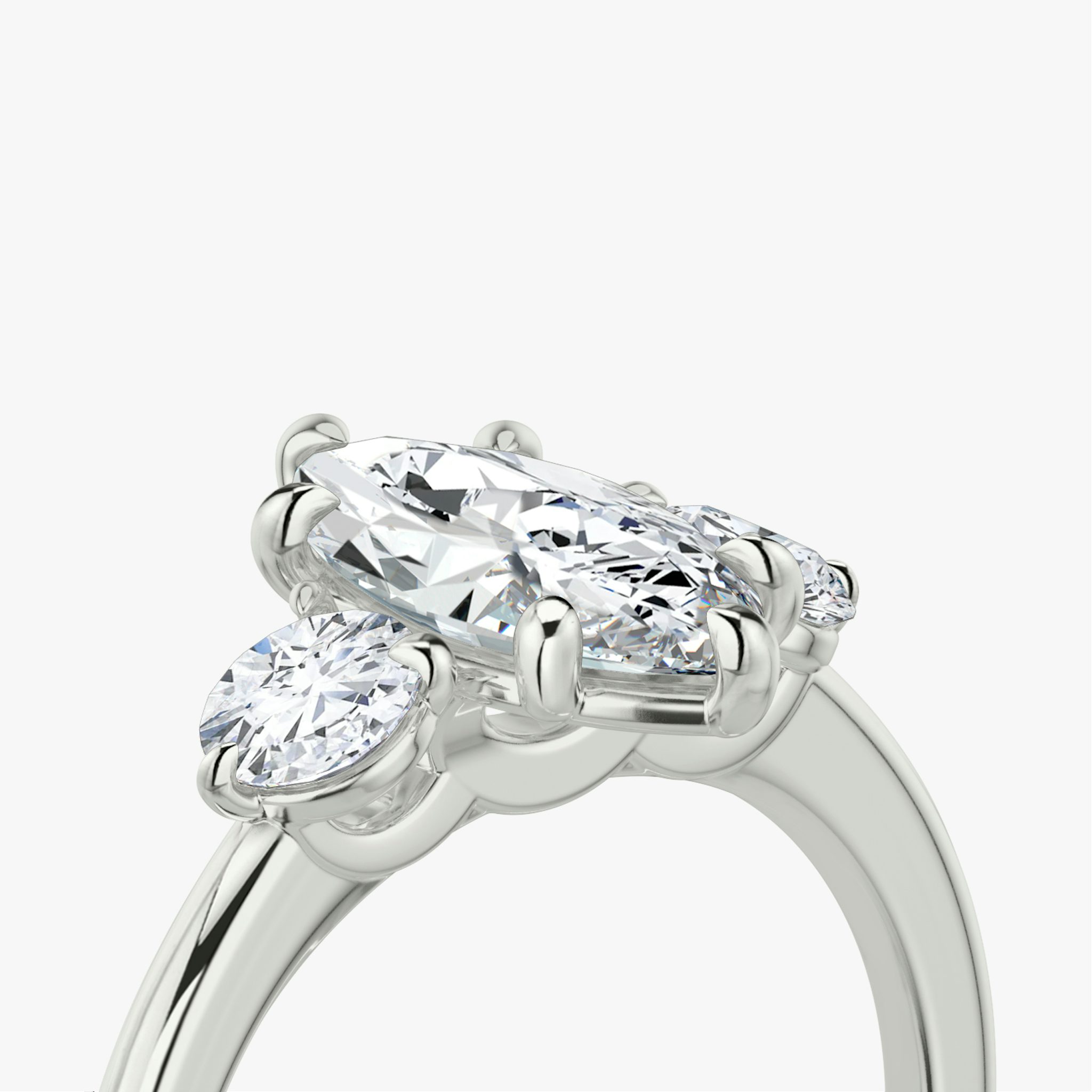 The Three Stone | Marquise | 18k | White Gold | bandAccent: Plain | sideStoneCarat: 0.25ct | sideStoneShape: Round Brilliant | diamondOrientation: vertical | caratWeight: other