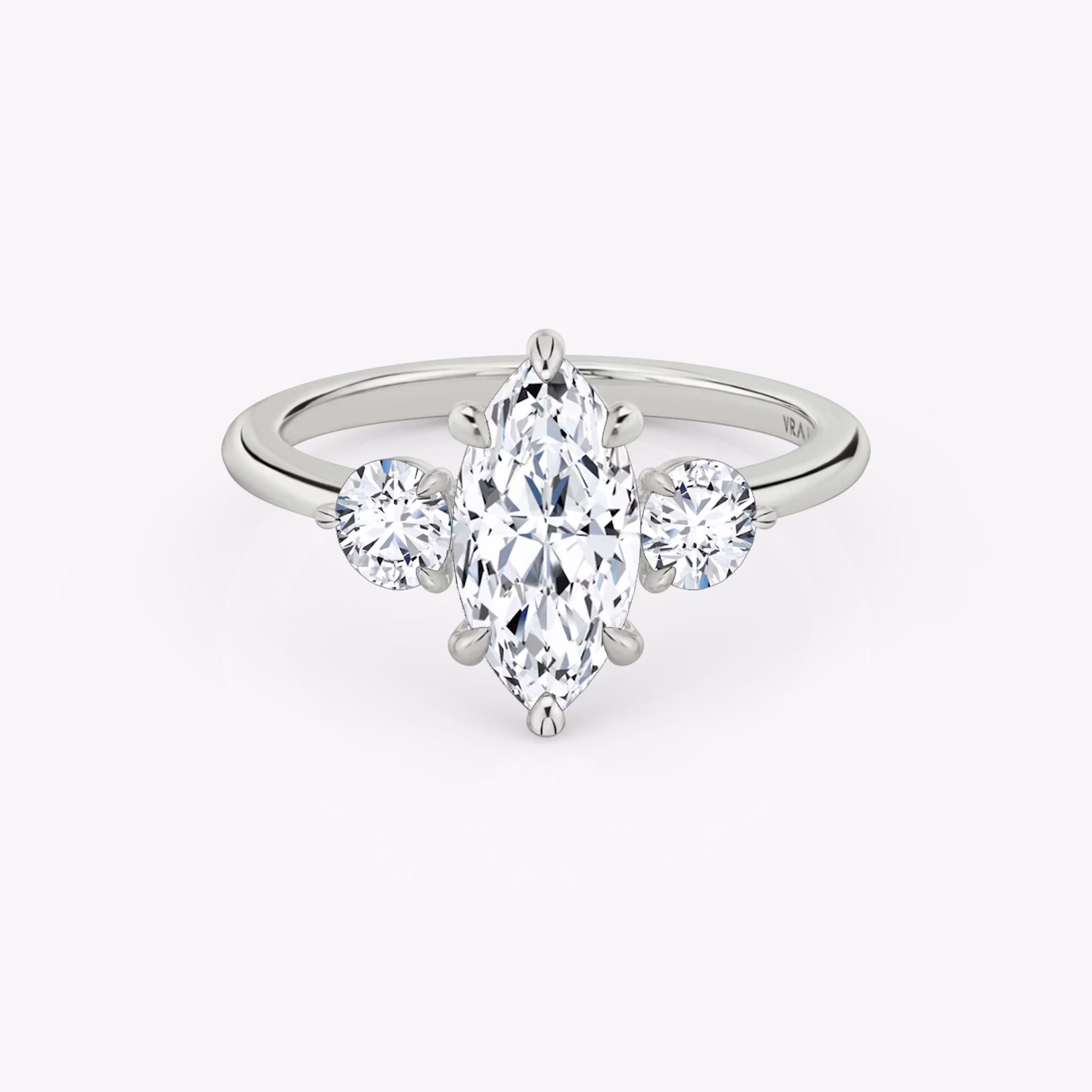 The Three Stone | Marquise | 18k | White Gold | bandAccent: Plain | sideStoneCarat: 0.25ct | sideStoneShape: Round Brilliant | diamondOrientation: vertical | caratWeight: other