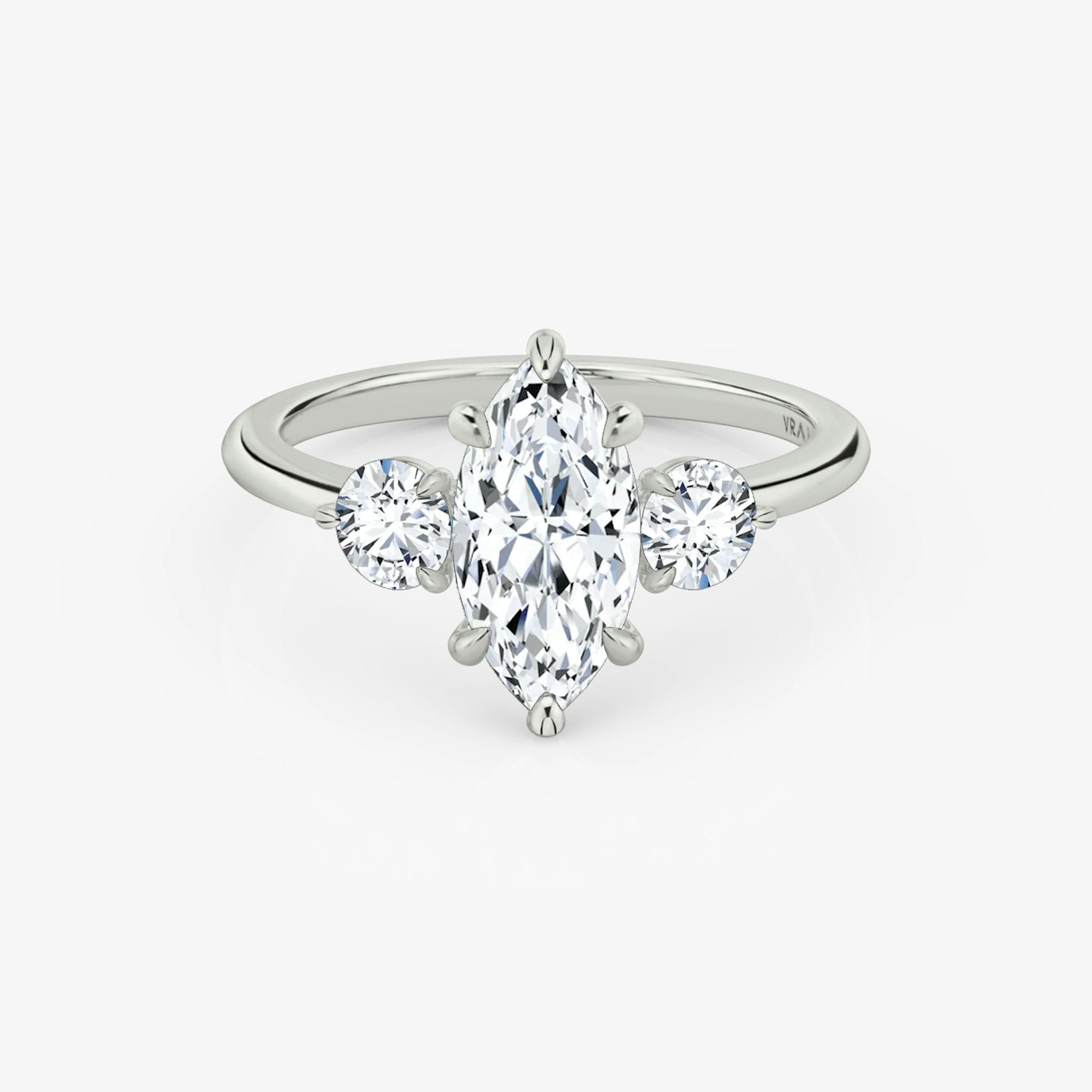 The Three Stone | Marquise | 18k | White Gold | bandAccent: Plain | sideStoneCarat: 0.25ct | sideStoneShape: Round Brilliant | diamondOrientation: vertical | caratWeight: other
