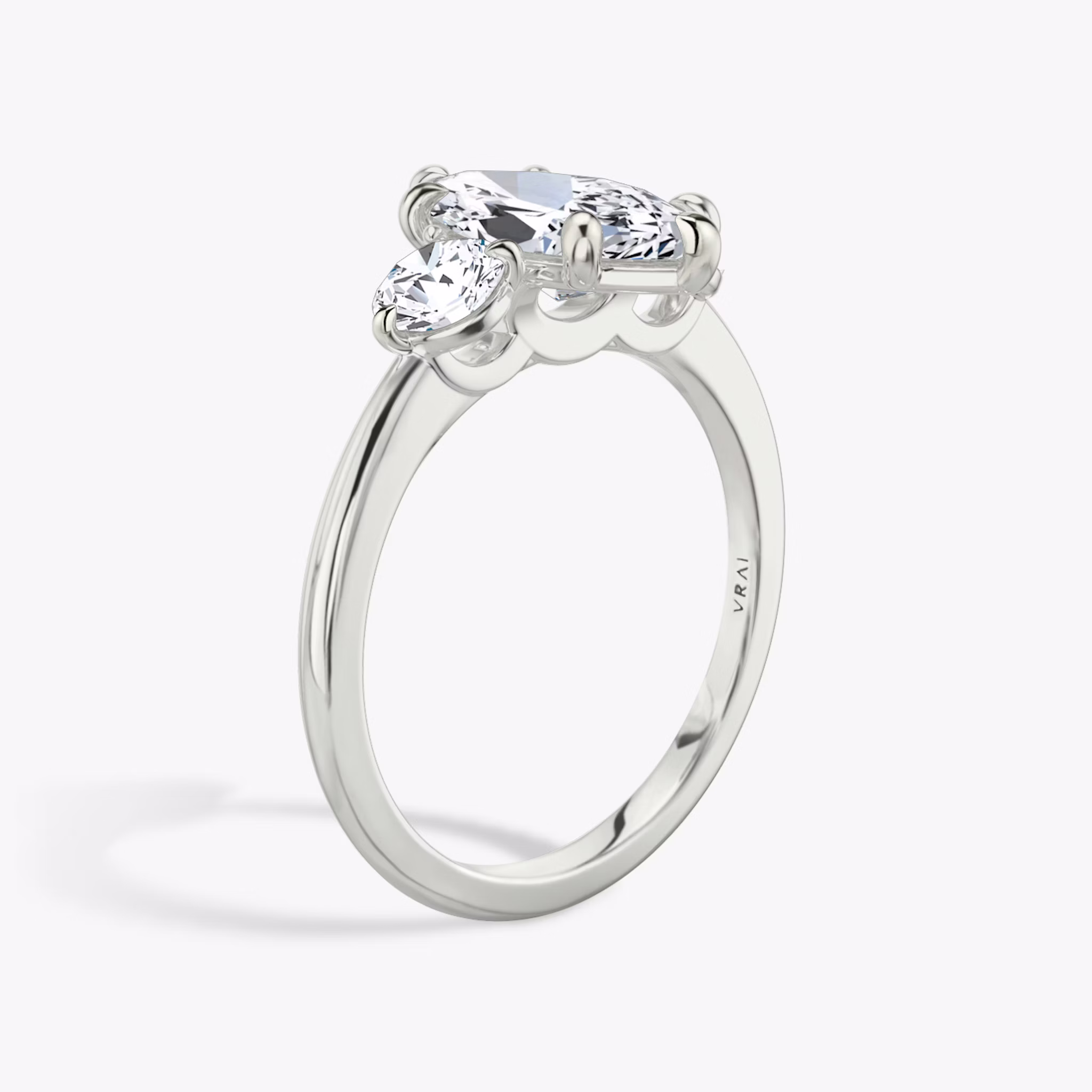 The Three Stone | Marquise | 18k | White Gold | bandAccent: Plain | sideStoneCarat: 0.25ct | sideStoneShape: Round Brilliant | diamondOrientation: vertical | caratWeight: other
