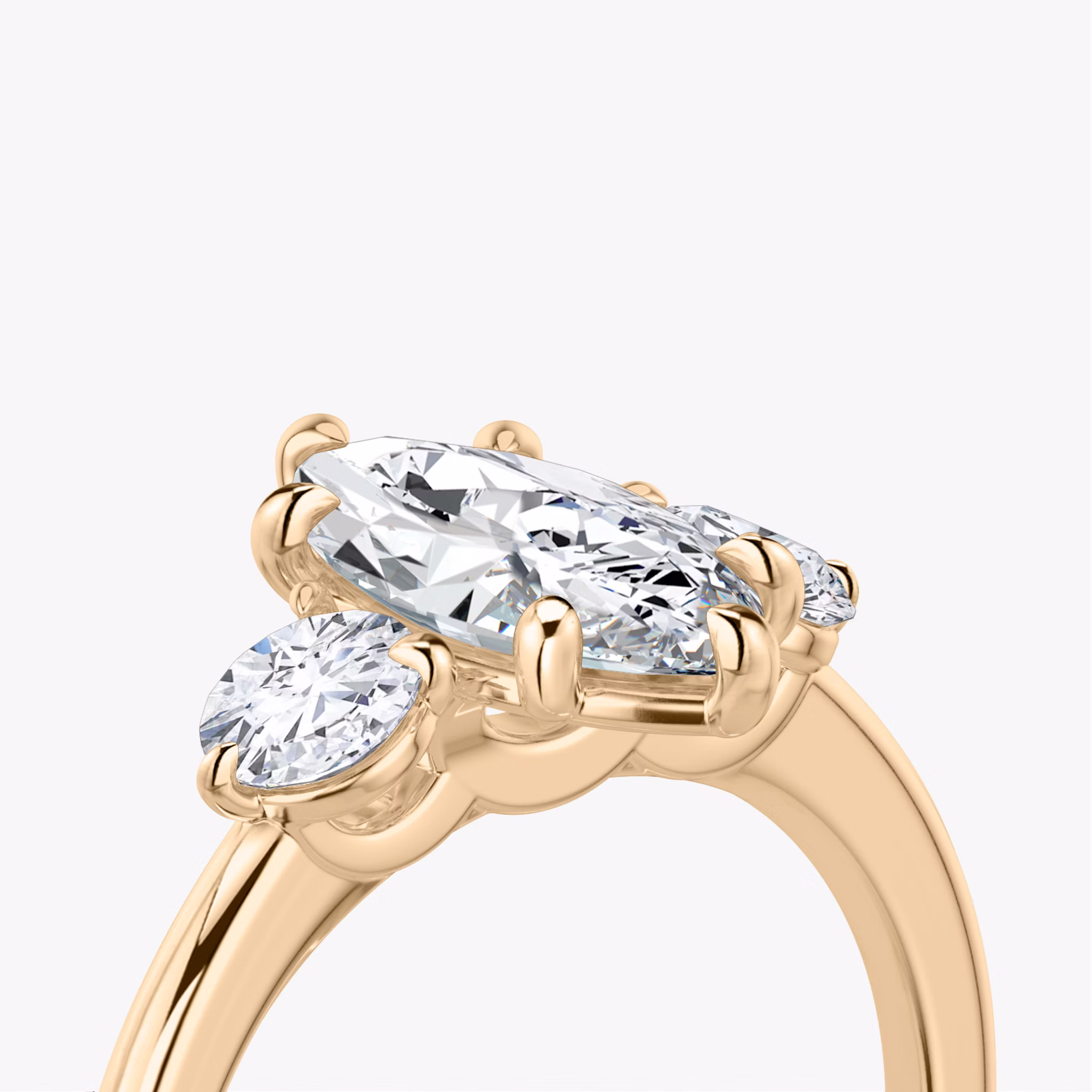 The Three Stone | Marquise | 14k | Rose Gold | bandAccent: Plain | sideStoneCarat: 0.25ct | sideStoneShape: Round Brilliant | diamondOrientation: vertical | caratWeight: other