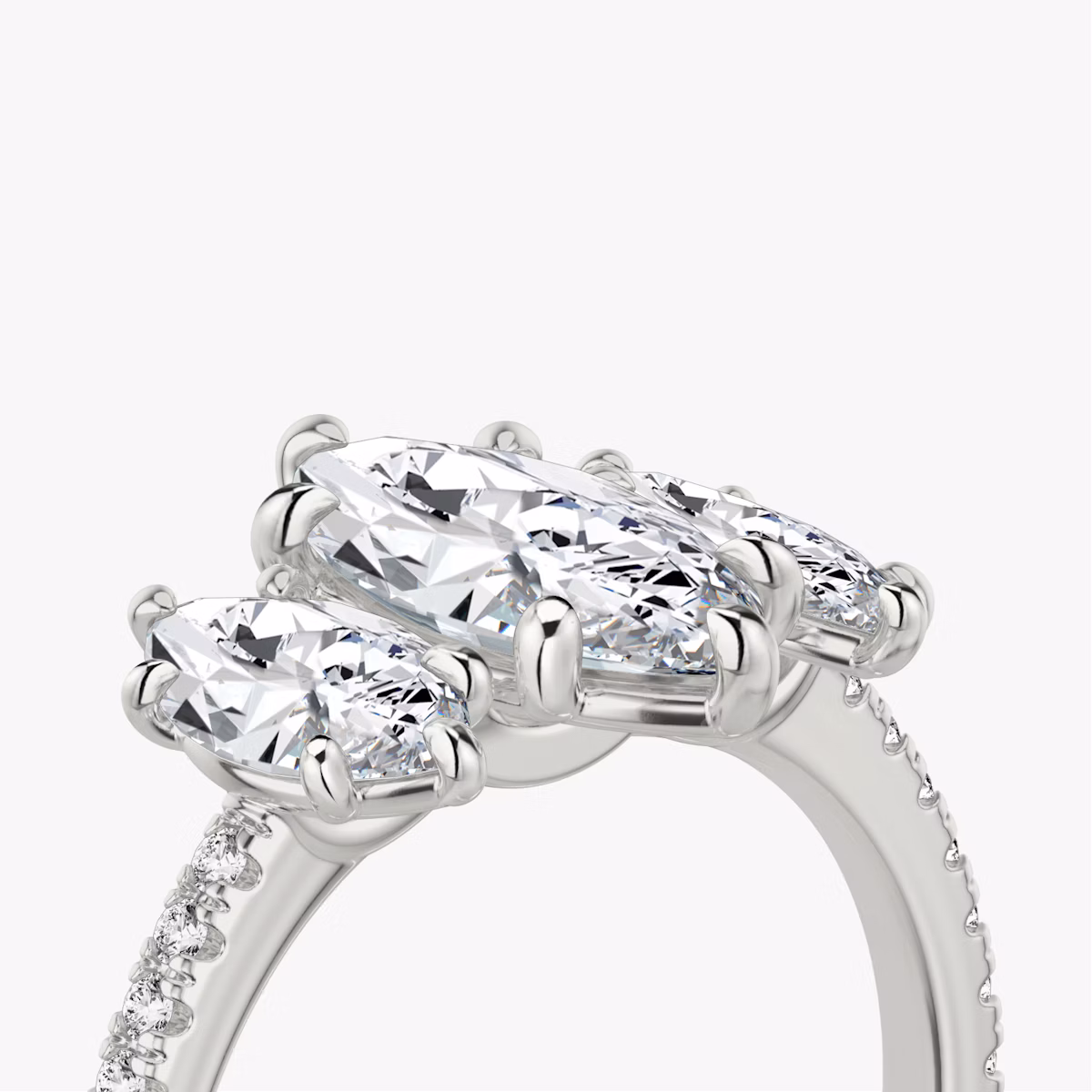 The Three Stone | Marquise | Platinum | bandAccent: Pavé | sideStoneCarat: 0.50ct | sideStoneShape: Marquise | diamondOrientation: vertical | caratWeight: other