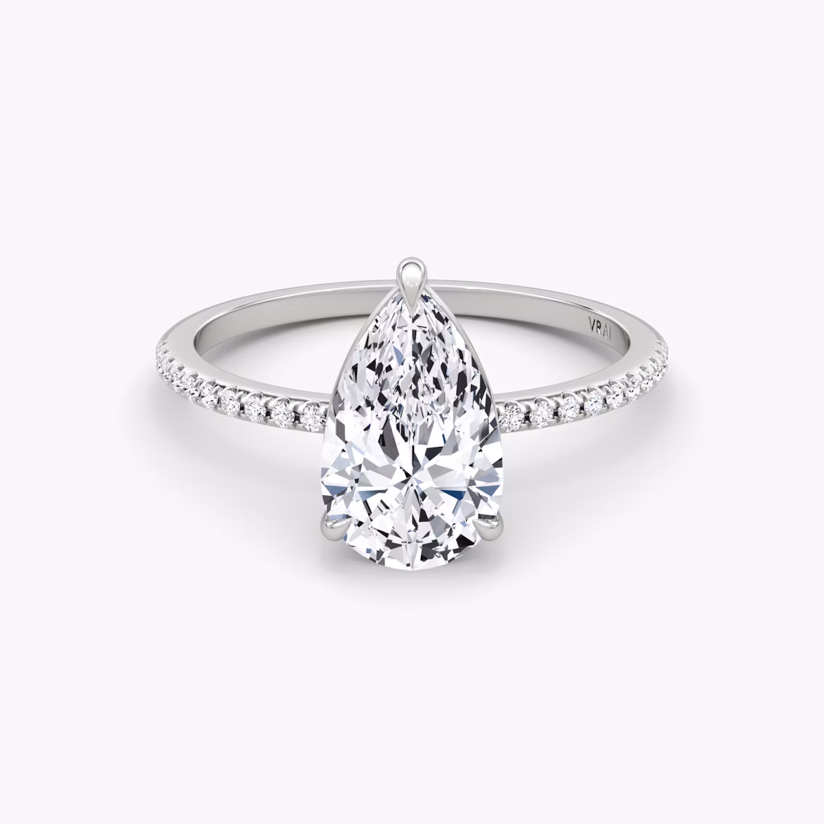 The Petite 4-Prong Solitaire | Pear | 18k | White Gold | bandAccent: Pavé | diamondOrientation: vertical | caratWeight: other