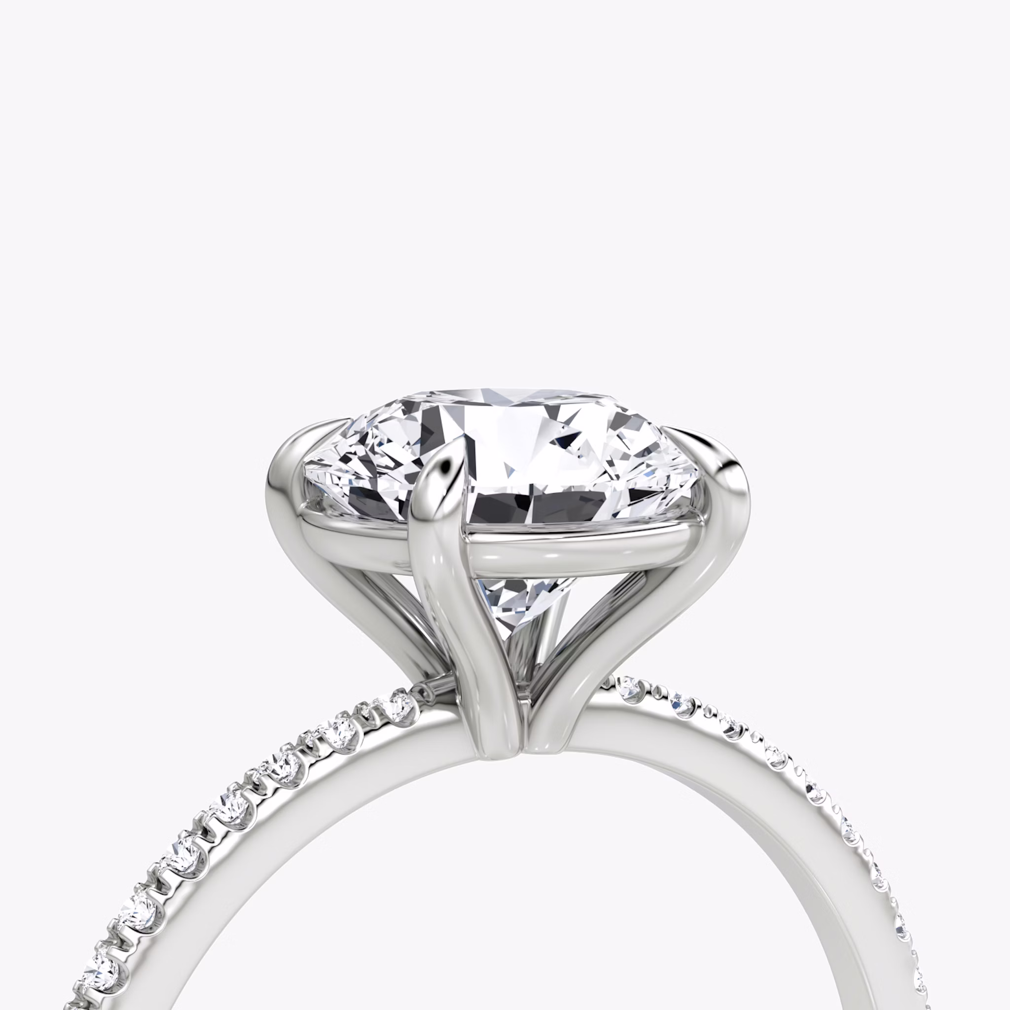 The Petite 4-Prong Solitaire | Round Brilliant | Platinum | bandAccent: Pavé | caratWeight: other | diamondOrientation: vertical