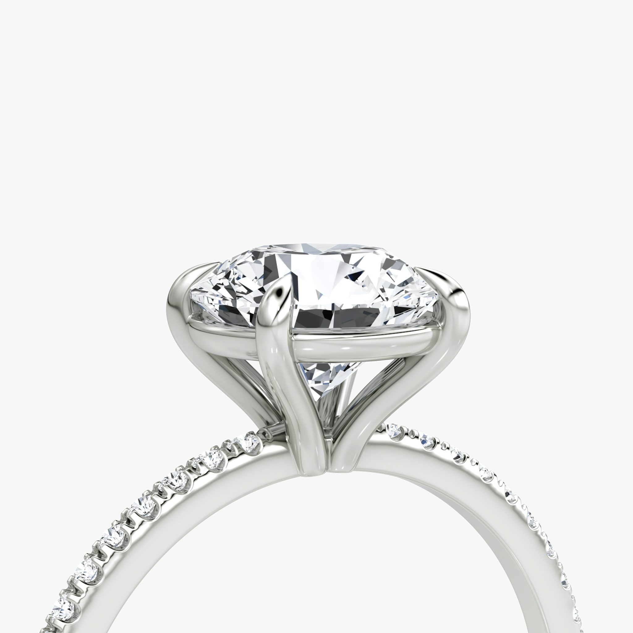 The Petite 4-Prong Solitaire | Round Brilliant | Platinum | bandAccent: Pavé | caratWeight: other | diamondOrientation: vertical