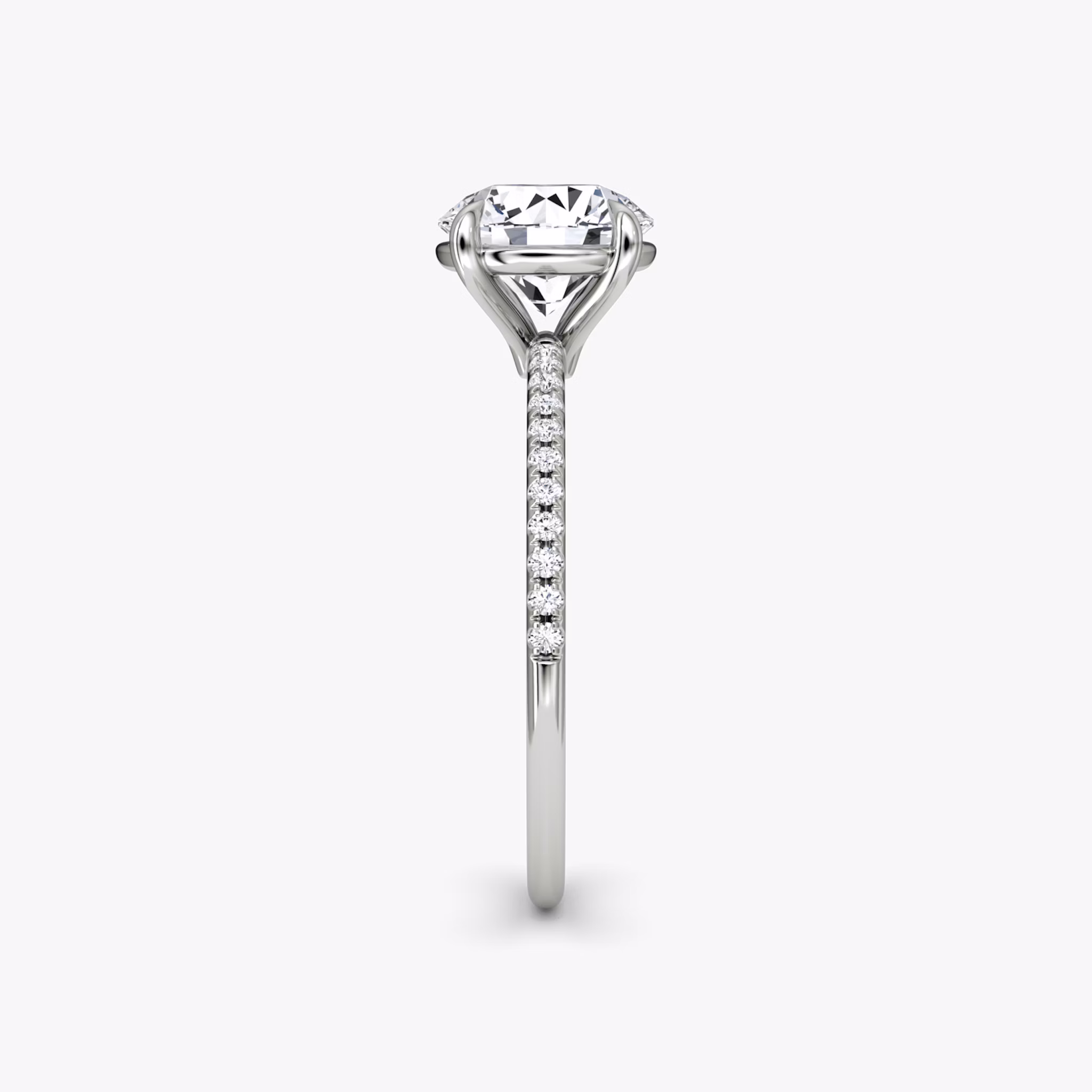 The Petite 4-Prong Solitaire | Round Brilliant | Platinum | bandAccent: Pavé | caratWeight: other | diamondOrientation: vertical