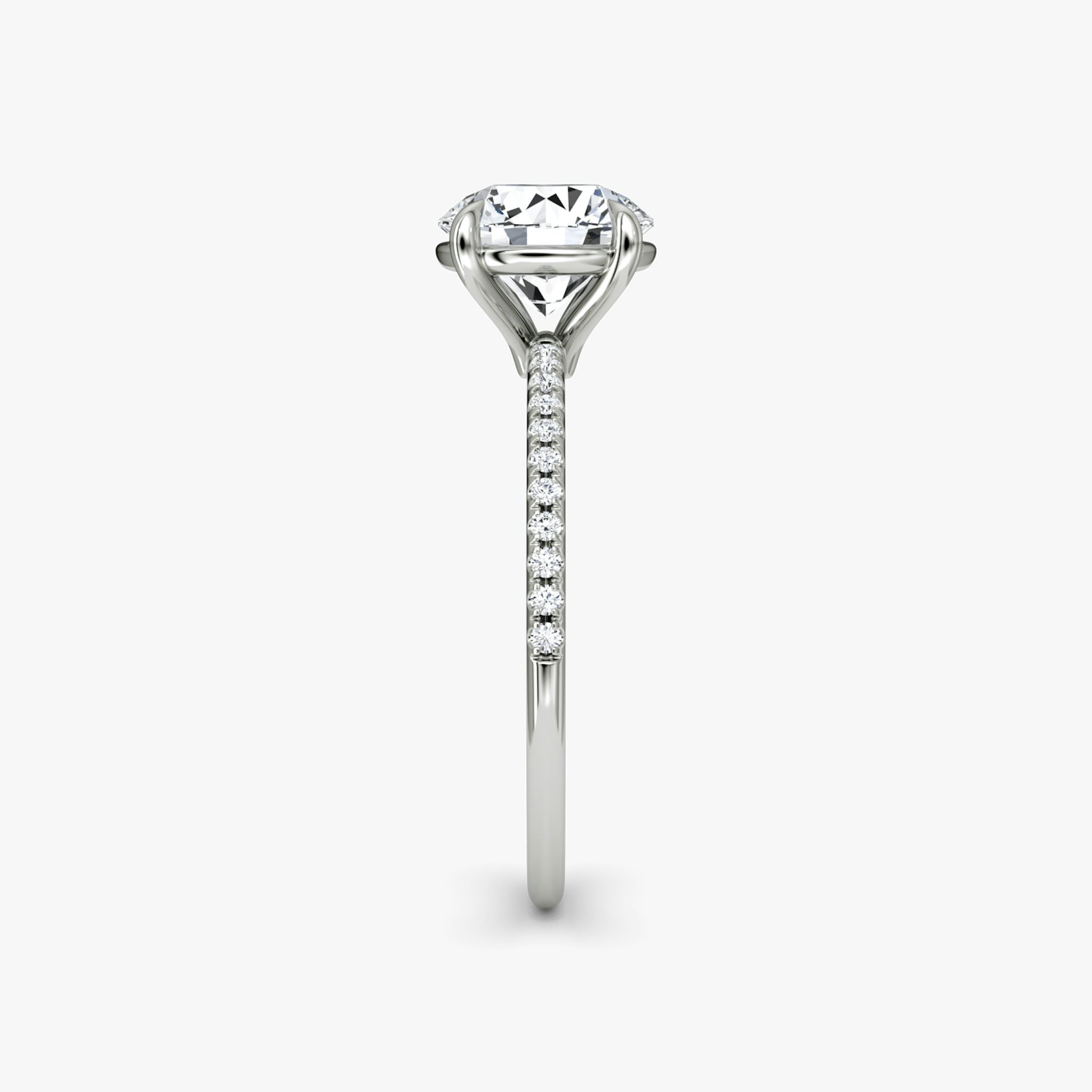 The Petite 4-Prong Solitaire | Round Brilliant | Platinum | bandAccent: Pavé | caratWeight: other | diamondOrientation: vertical