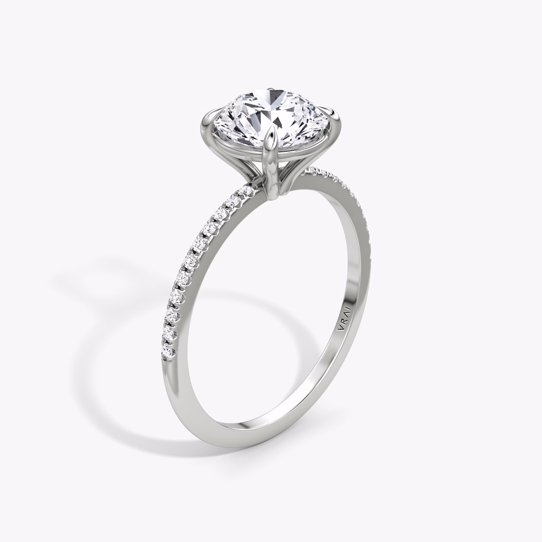 The Petite 4-Prong Solitaire | Round Brilliant | Platinum | bandAccent: Pavé | caratWeight: other | diamondOrientation: vertical