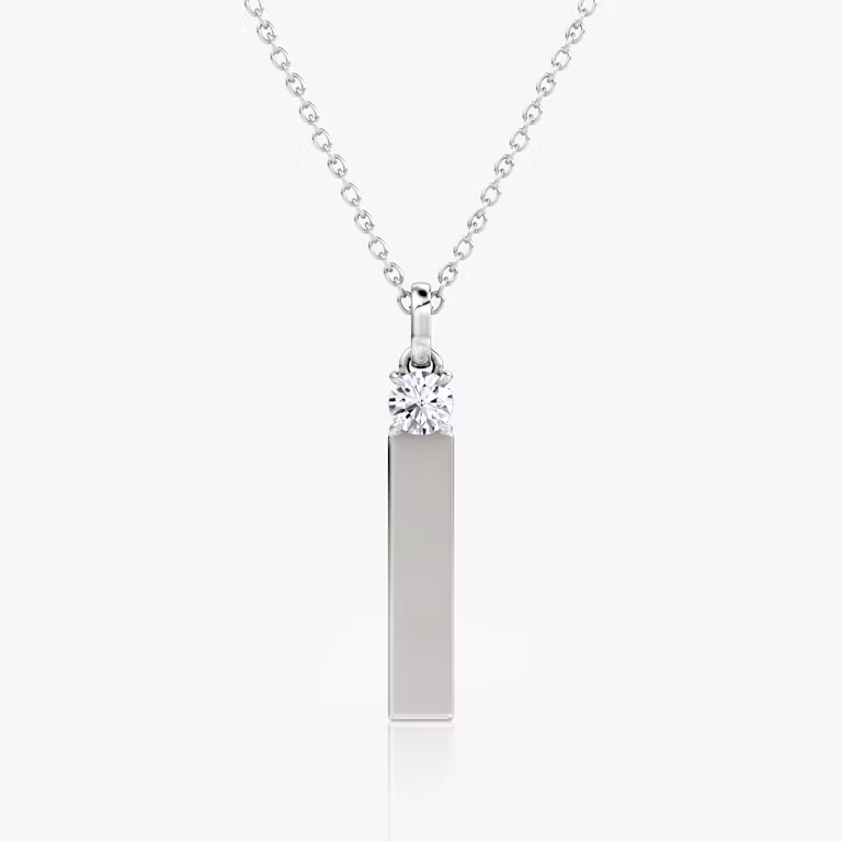 0.25-carat round brilliant diamond mounted above a sleek sterling silver bar, modern pendant necklace design.