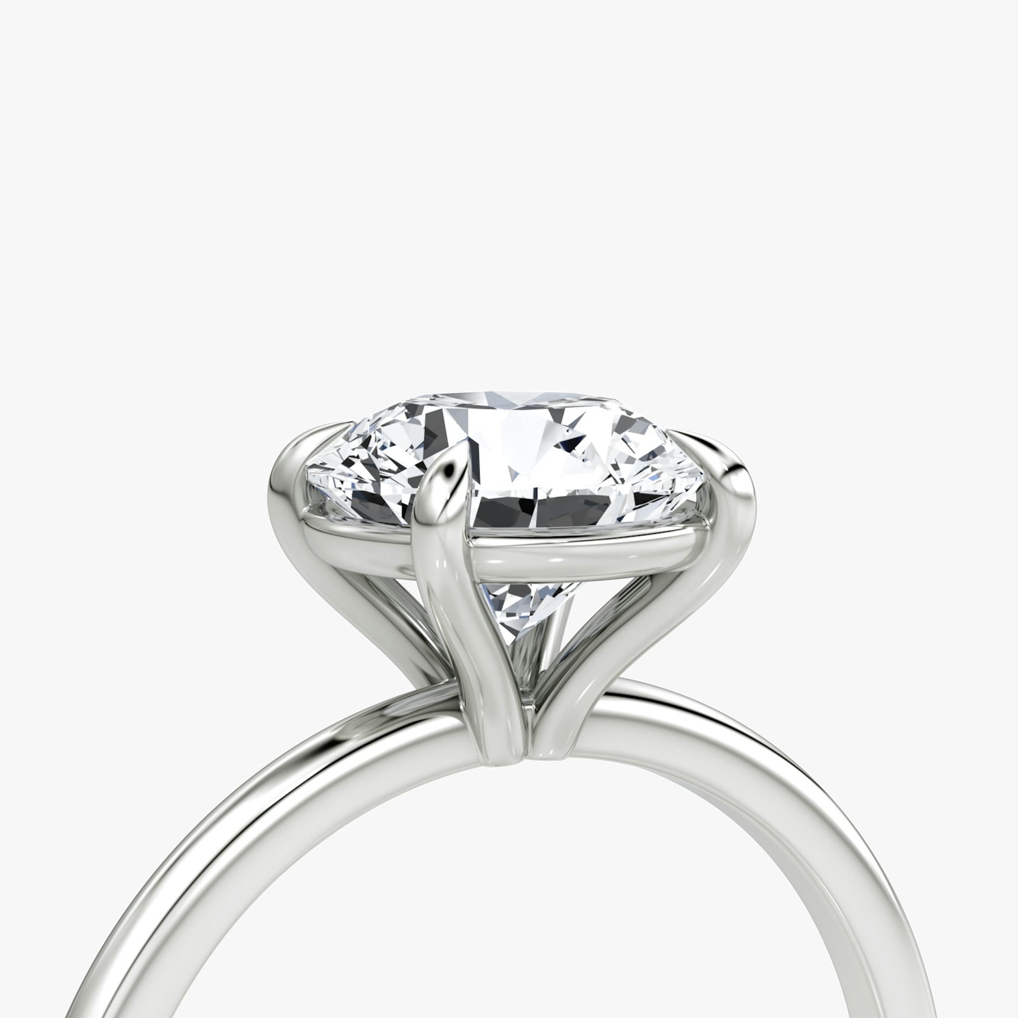 The Petite 4-Prong Solitaire | Round Brilliant | Platinum | bandAccent: Plain | caratWeight: other | diamondOrientation: vertical
