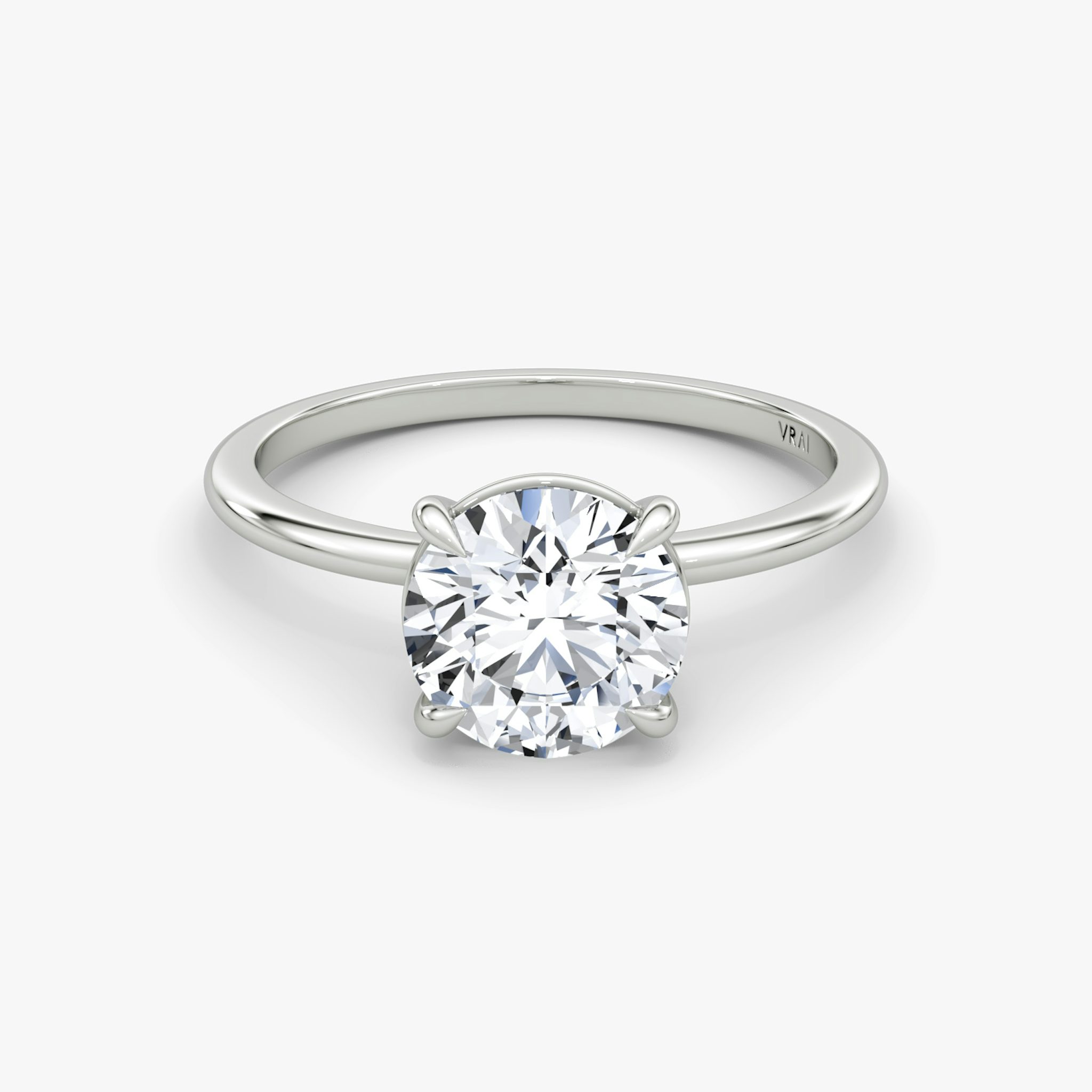 The Petite 4-Prong Solitaire | Round Brilliant | Platinum | bandAccent: Plain | caratWeight: other | diamondOrientation: vertical