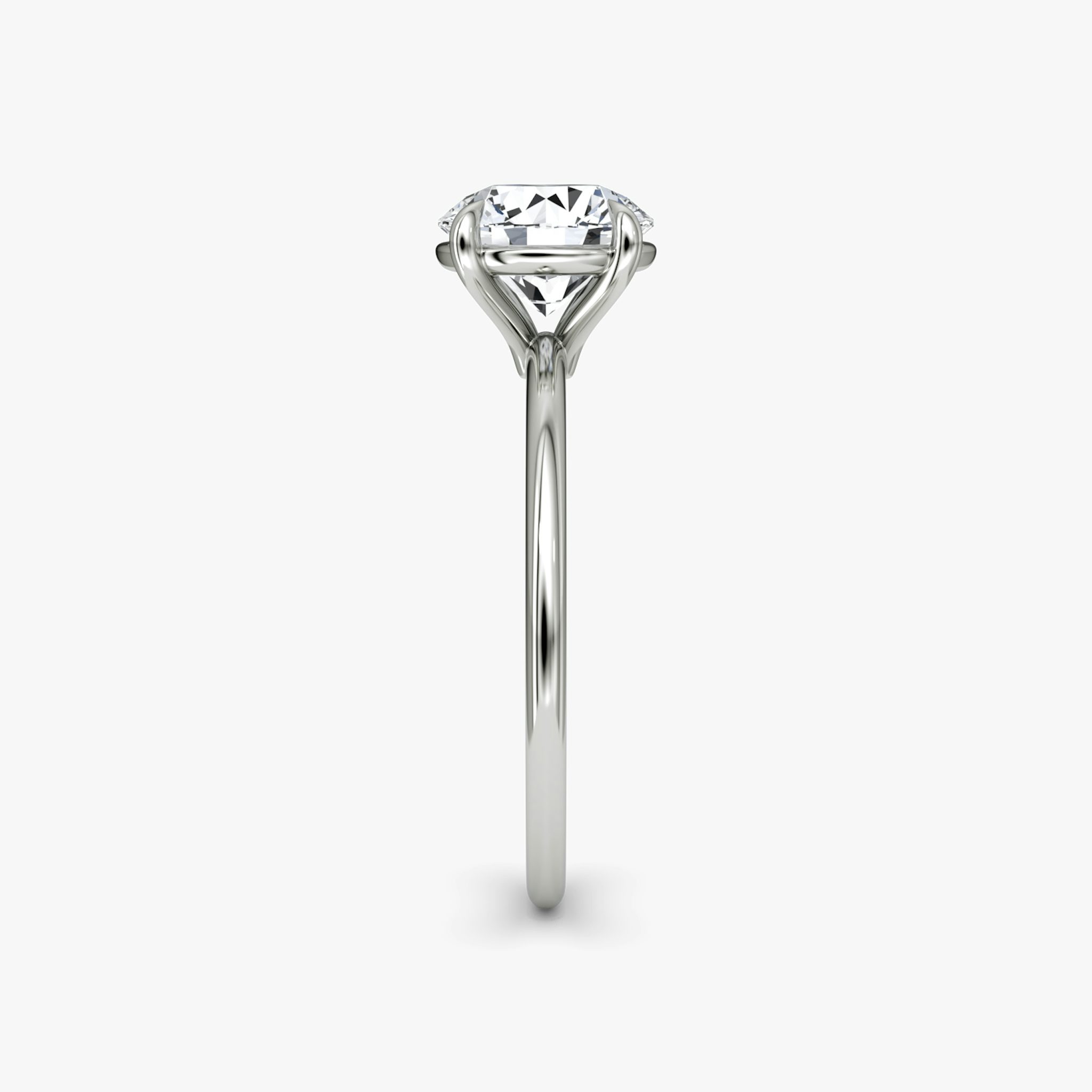 The Petite 4-Prong Solitaire | Round Brilliant | Platinum | bandAccent: Plain | caratWeight: other | diamondOrientation: vertical