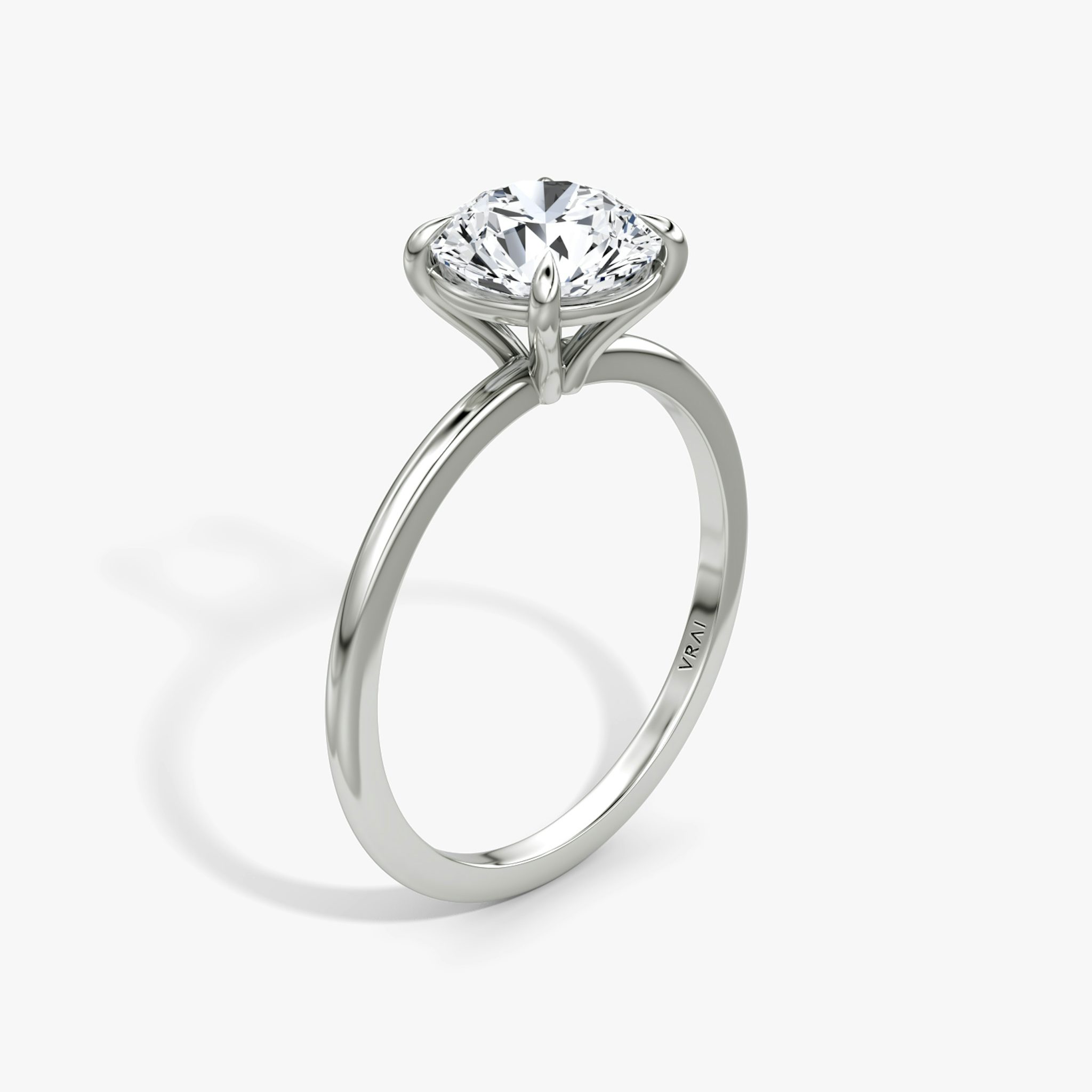The Petite 4-Prong Solitaire | Round Brilliant | Platinum | bandAccent: Plain | caratWeight: other | diamondOrientation: vertical