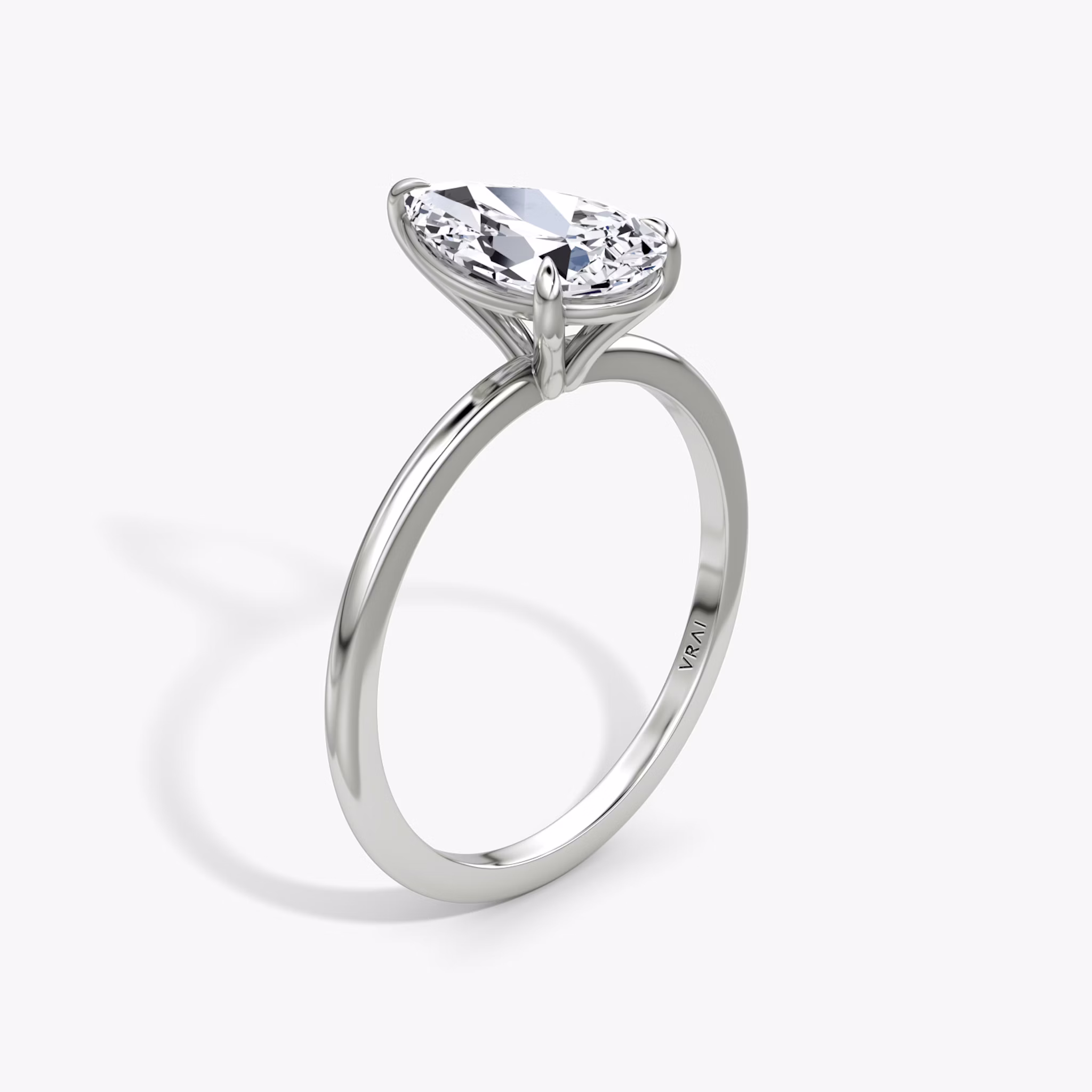 The Petite 4-Prong Solitaire | Pear | Platinum | bandAccent: Plain | diamondOrientation: vertical | caratWeight: other