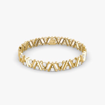 A V tennis bracelet in gold, with a white background.