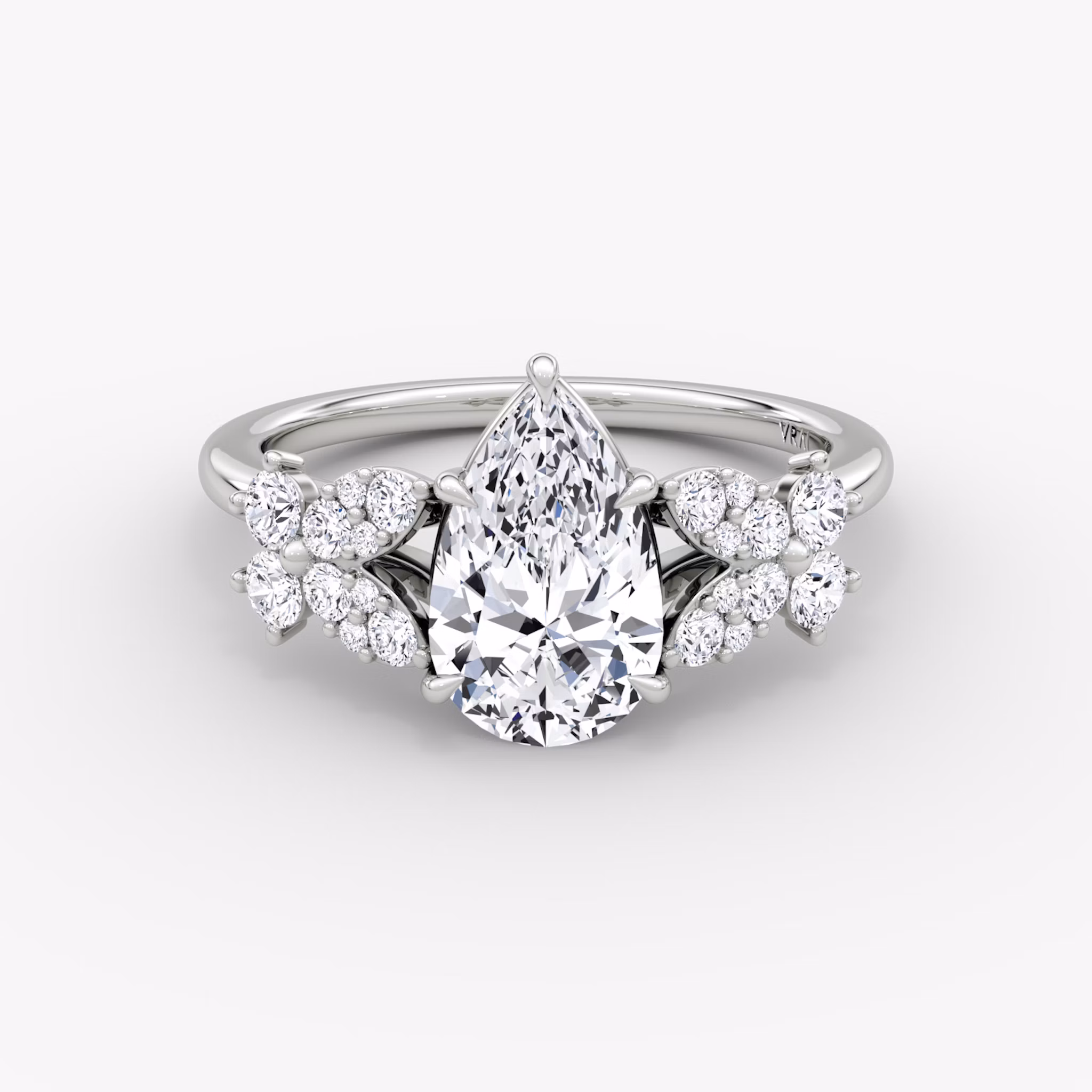Front view of the signature floral pear white gold engagement ring