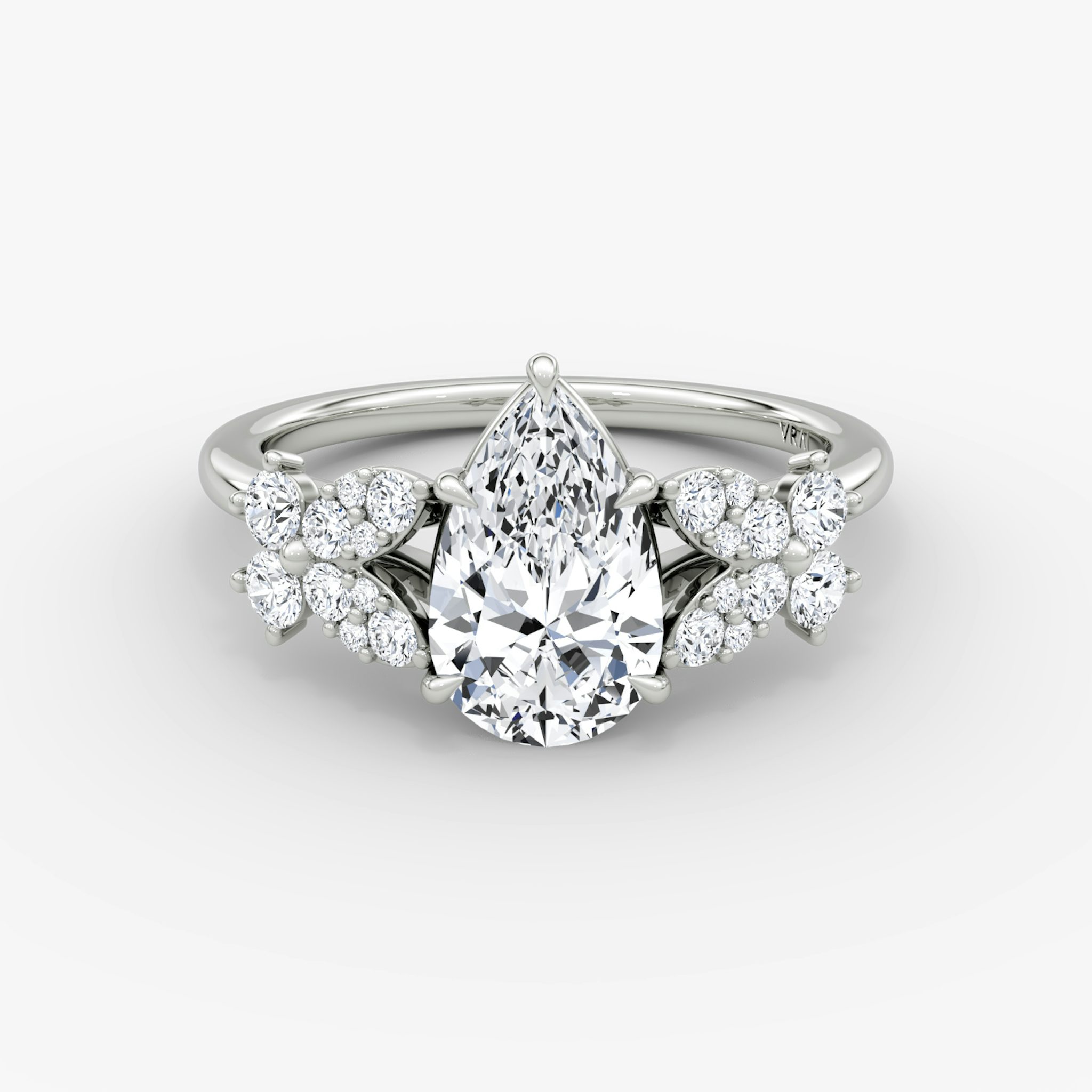 Front view of the signature floral pear white gold engagement ring