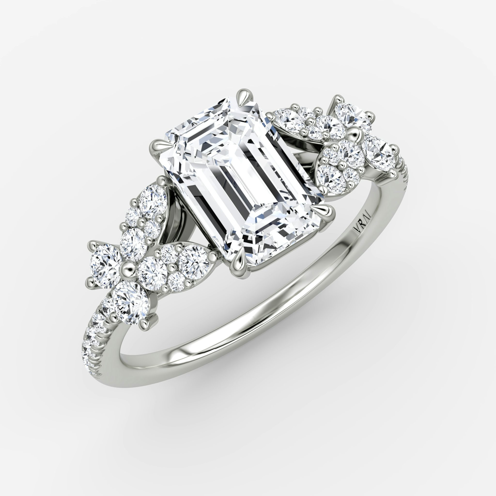 The Signature Floral | Emerald | Platinum | bandAccent: Pavé | diamondOrientation: vertical | caratWeight: other