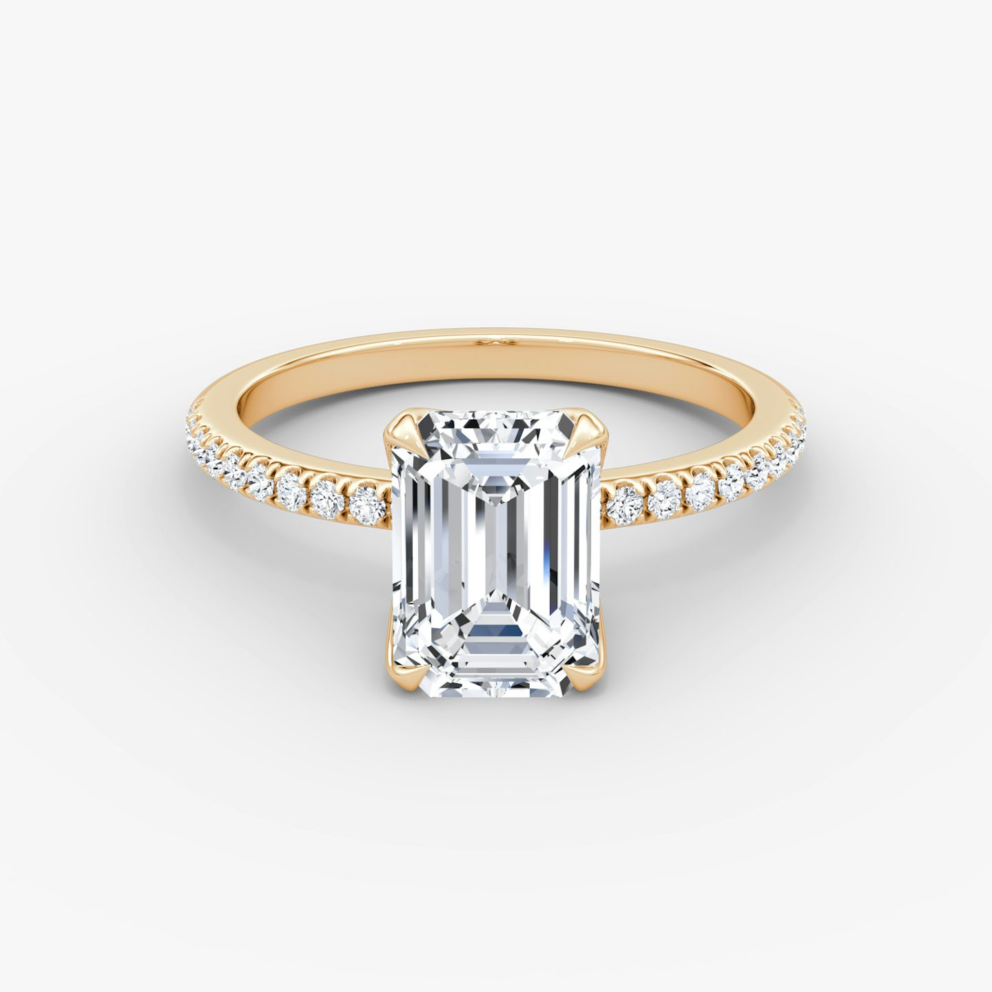 Emerald-cut diamond ring with pavé band and petal prongs in rose gold, VRAI Petal Classic setting.