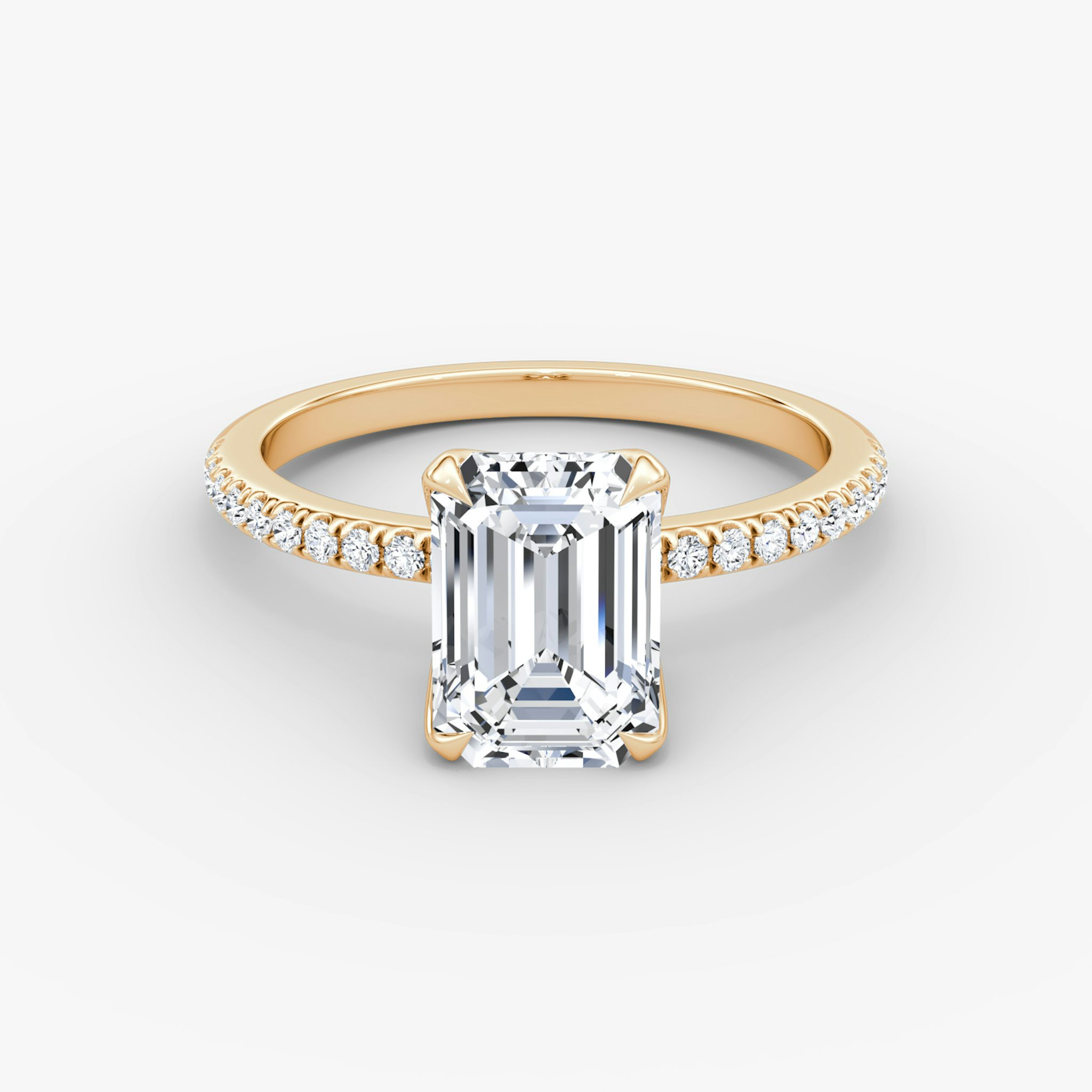 Emerald-cut diamond ring with pavé band and petal prongs in rose gold, VRAI Petal Classic setting.
