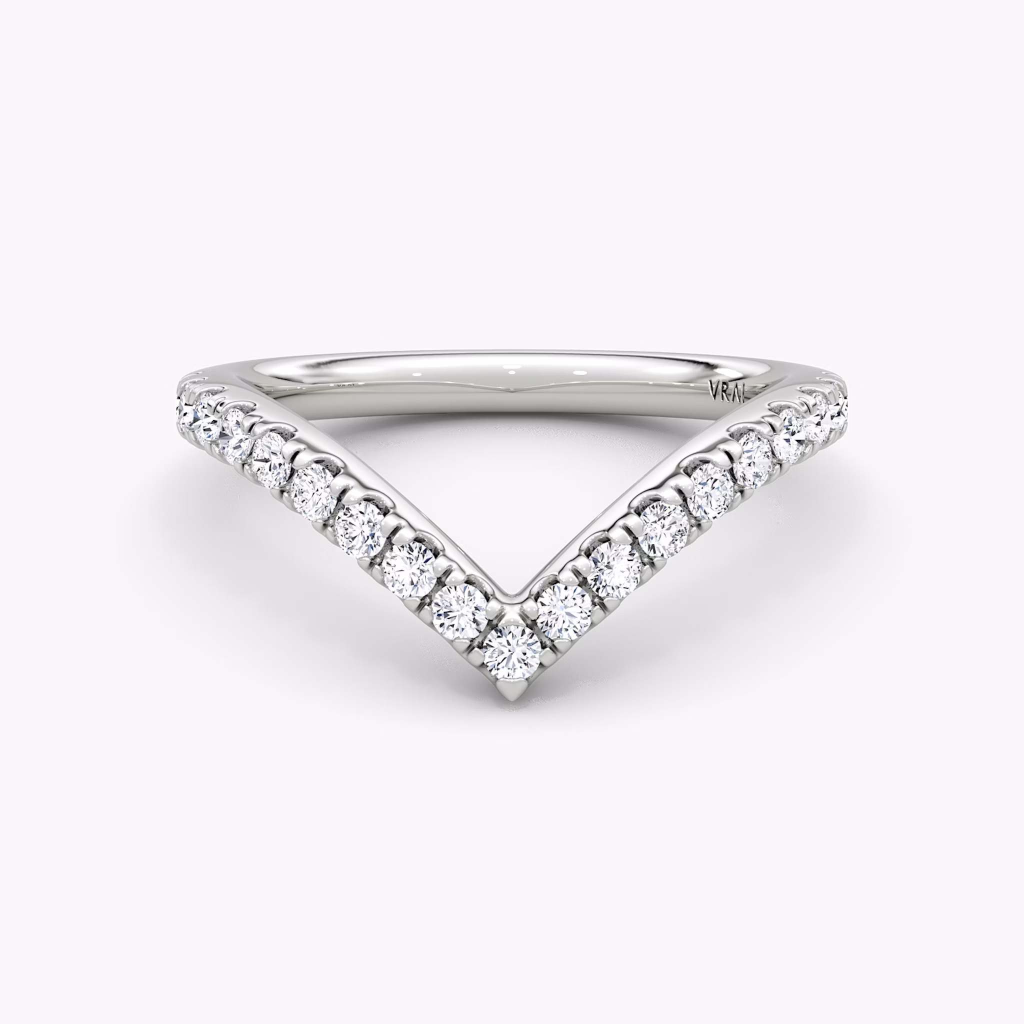 Signature V-band ring with pavé-set stones, crafted in platinum, shown on white background.