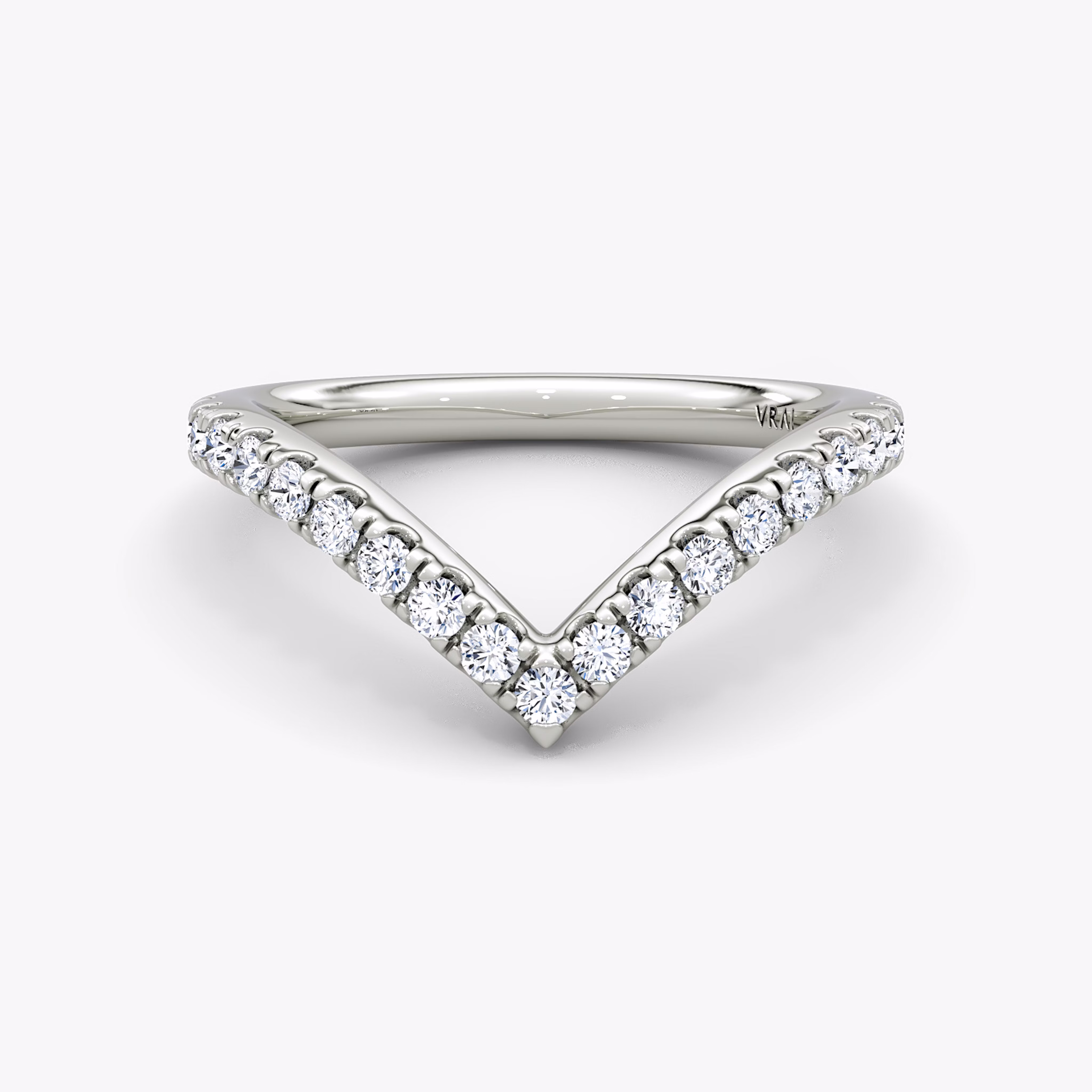 Signature V-band ring with pavé-set stones, crafted in platinum, shown on white background.