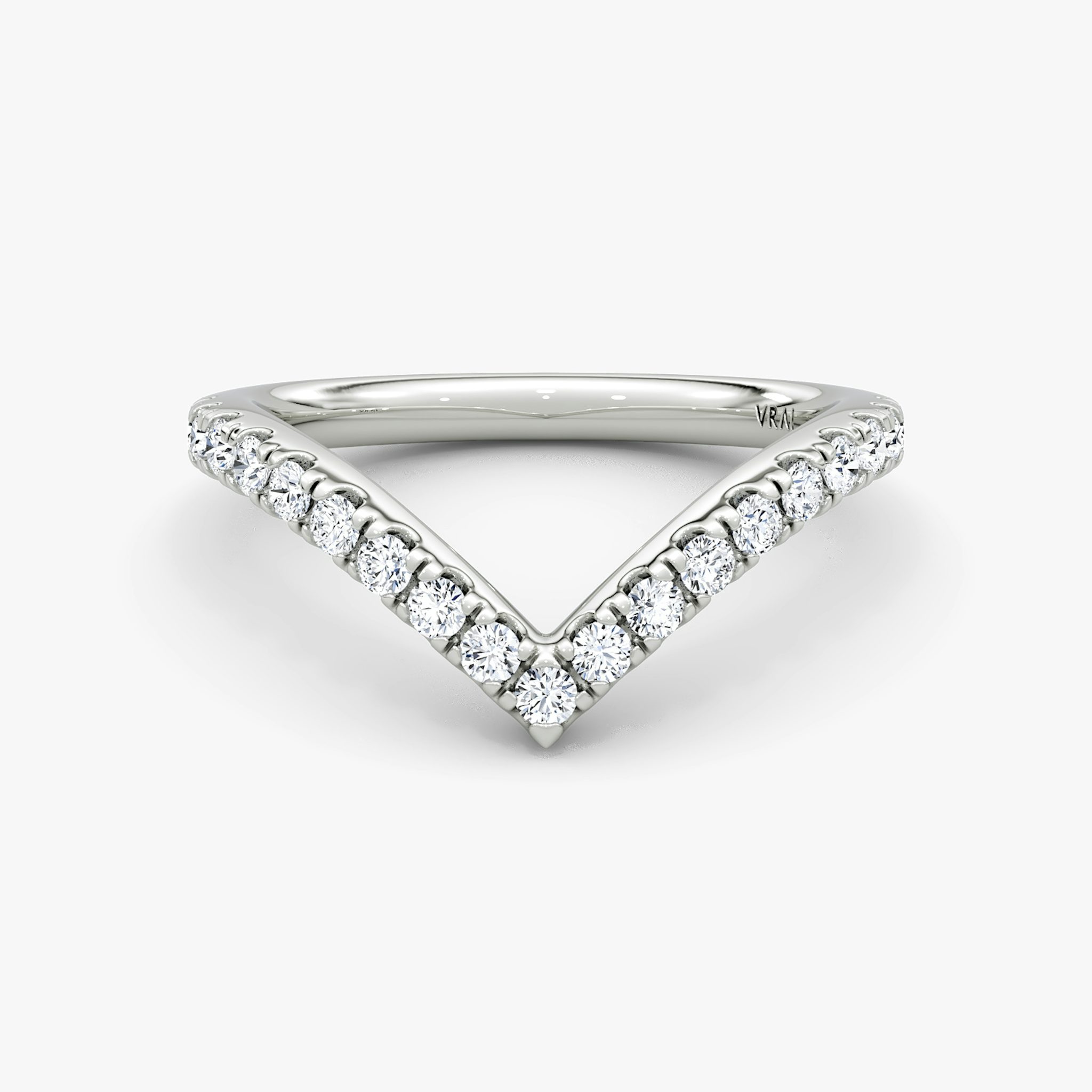 Signature V-band ring with pavé-set stones, crafted in platinum, shown on white background.