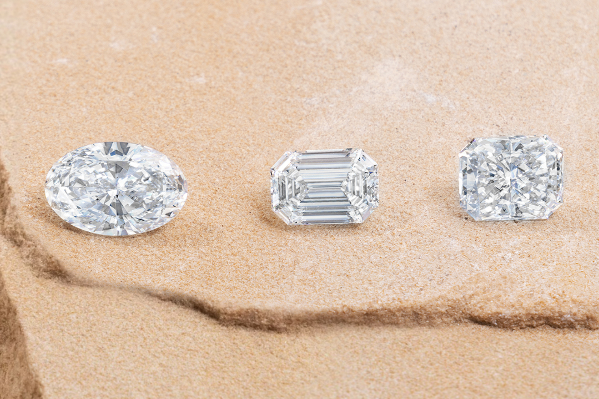 three lab grown diamonds including oval and emerald cut