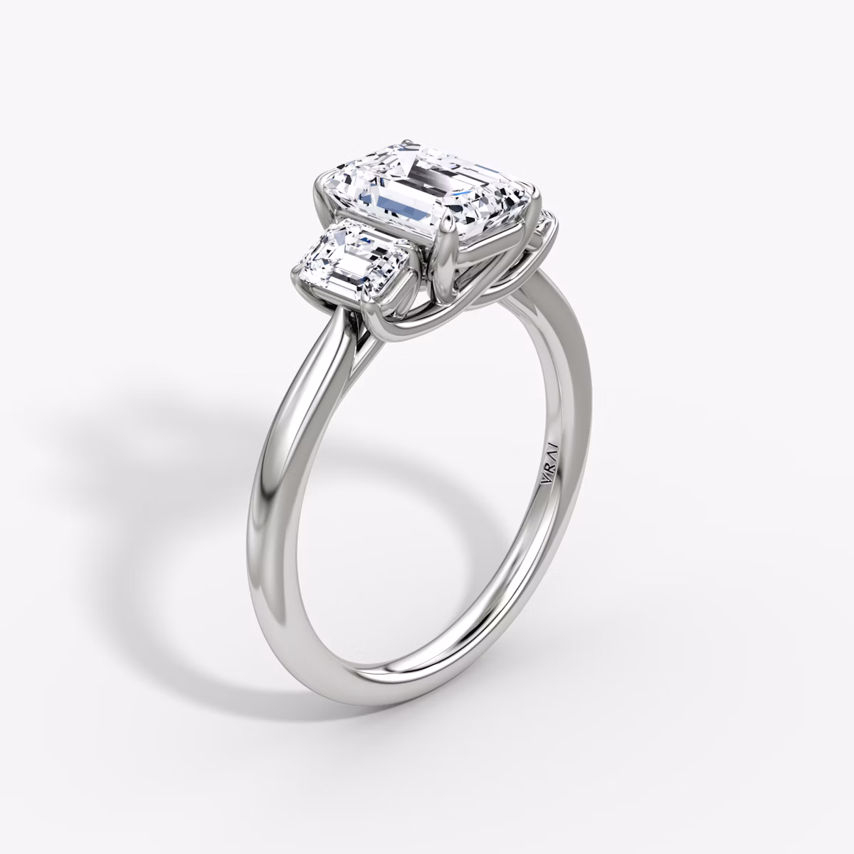 The Trellis Three Stone | Emerald | Platinum | bandAccent: Plain | diamondOrientation: vertical | caratWeight: other
