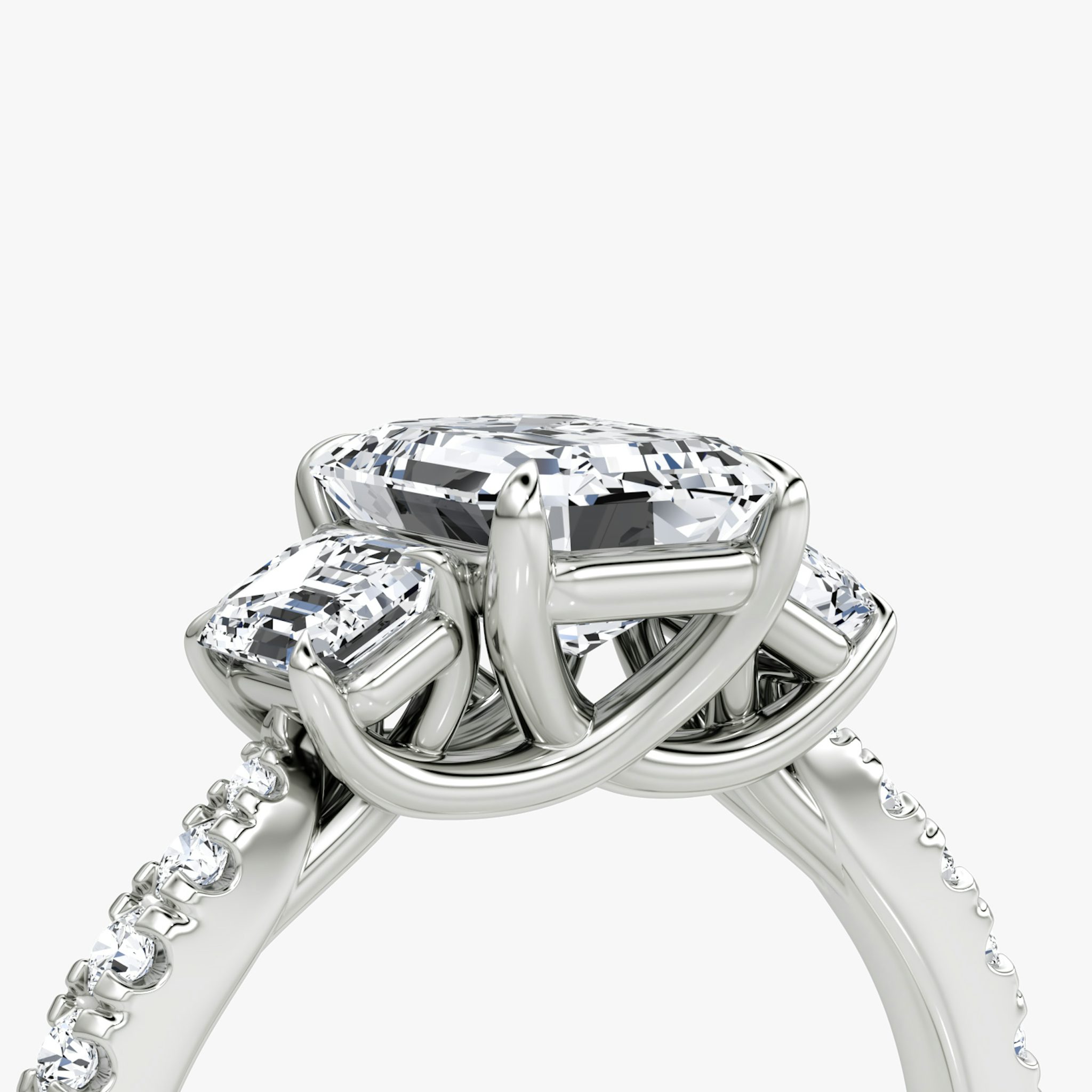 The Trellis Three Stone | Emerald | Platinum | bandAccent: Pavé | diamondOrientation: vertical | caratWeight: other
