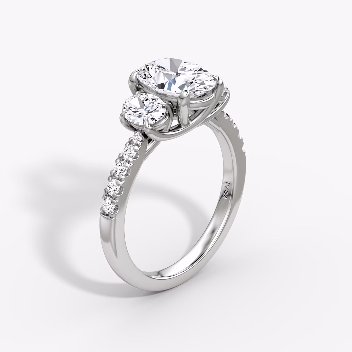 The Trellis Three Stone | Oval | 18k | White Gold | bandAccent: Pavé | diamondOrientation: vertical | caratWeight: other