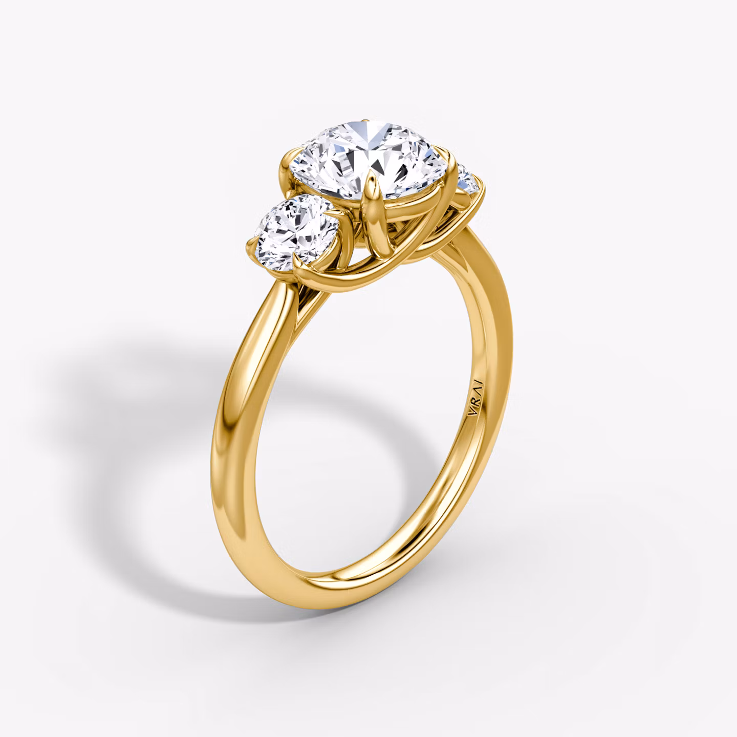 The Trellis Three Stone Round Brilliant | Yellow Gold