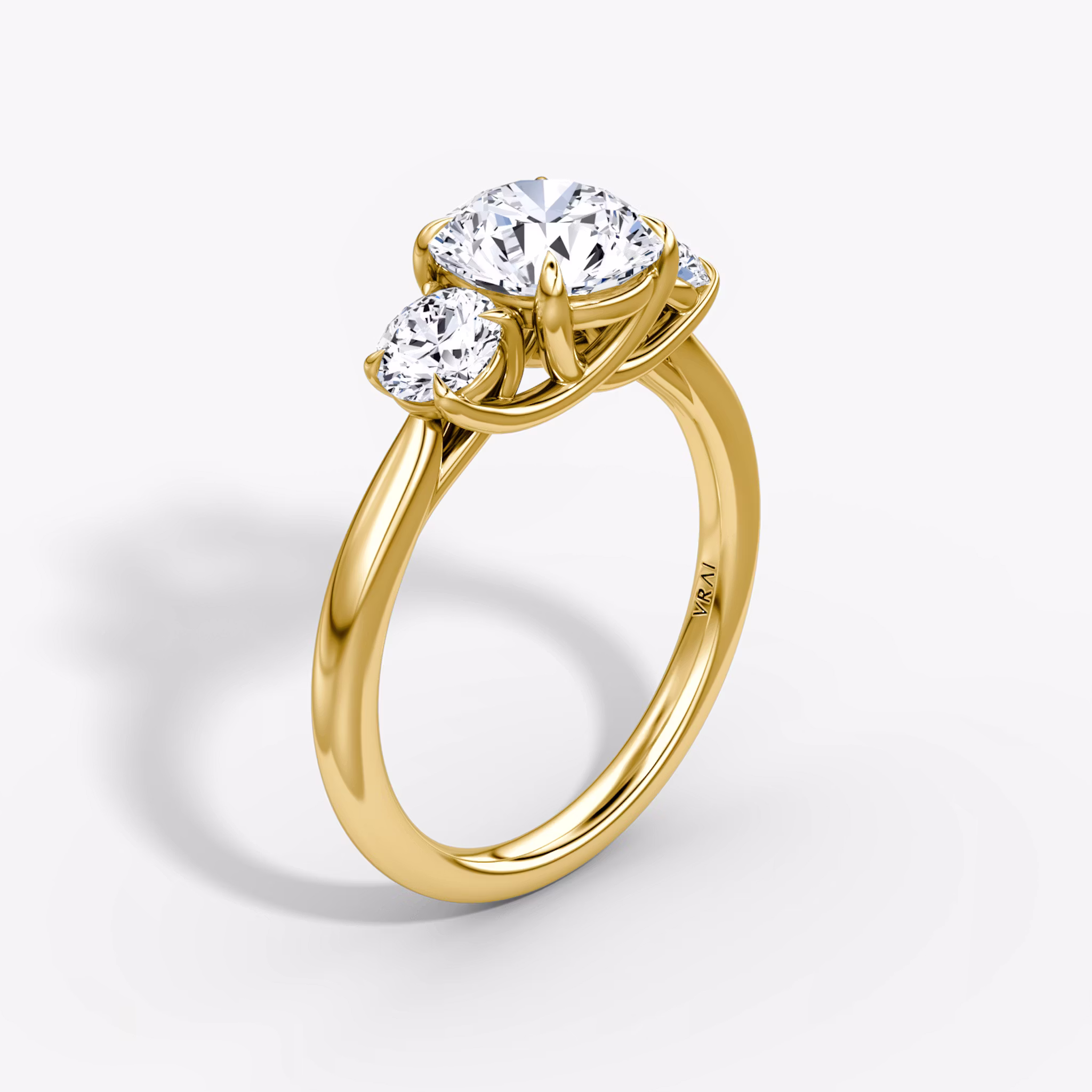 The Trellis Three Stone Round Brilliant | Yellow Gold