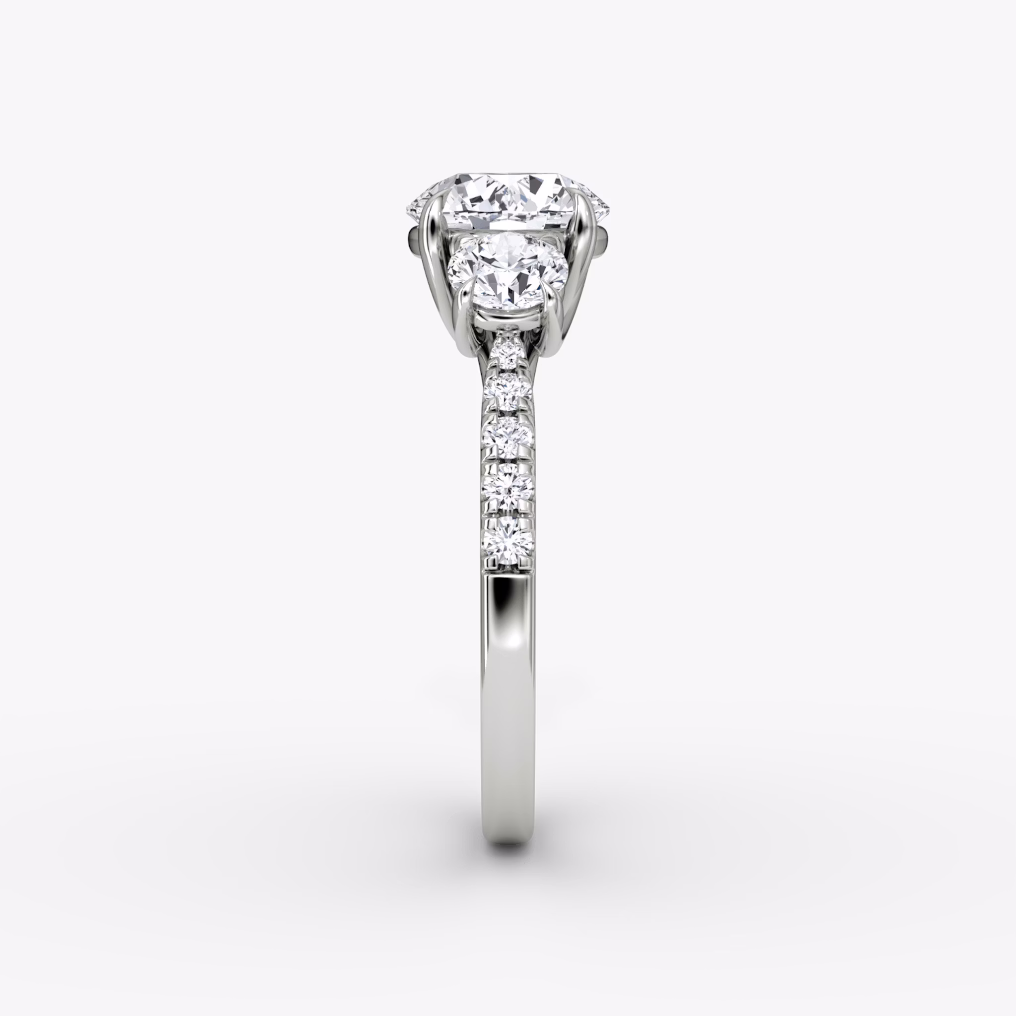 The Trellis Three Stone | Round Brilliant | Platinum | bandAccent: Pavé | caratWeight: other | diamondOrientation: vertical