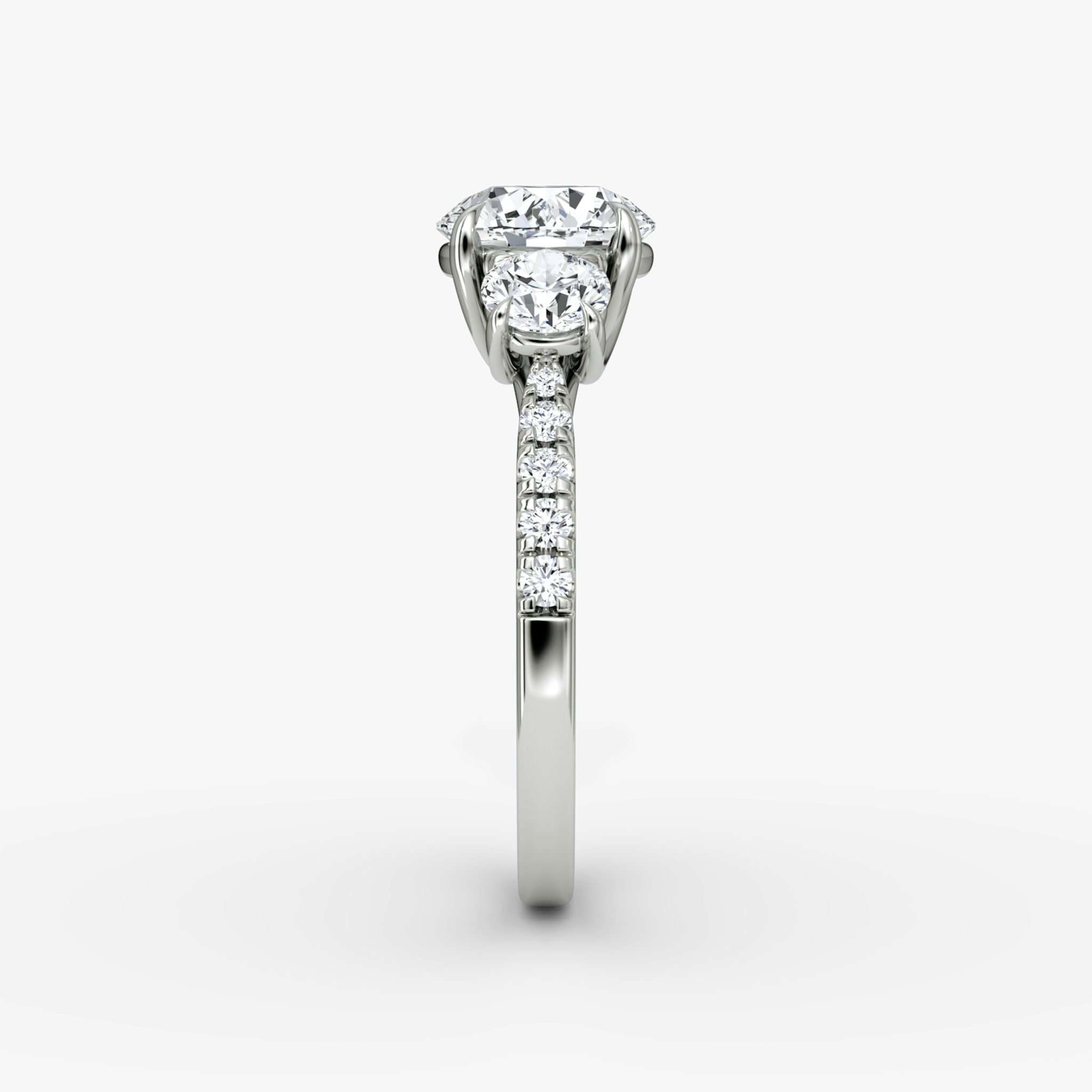 The Trellis Three Stone | Round Brilliant | Platinum | bandAccent: Pavé | caratWeight: other | diamondOrientation: vertical